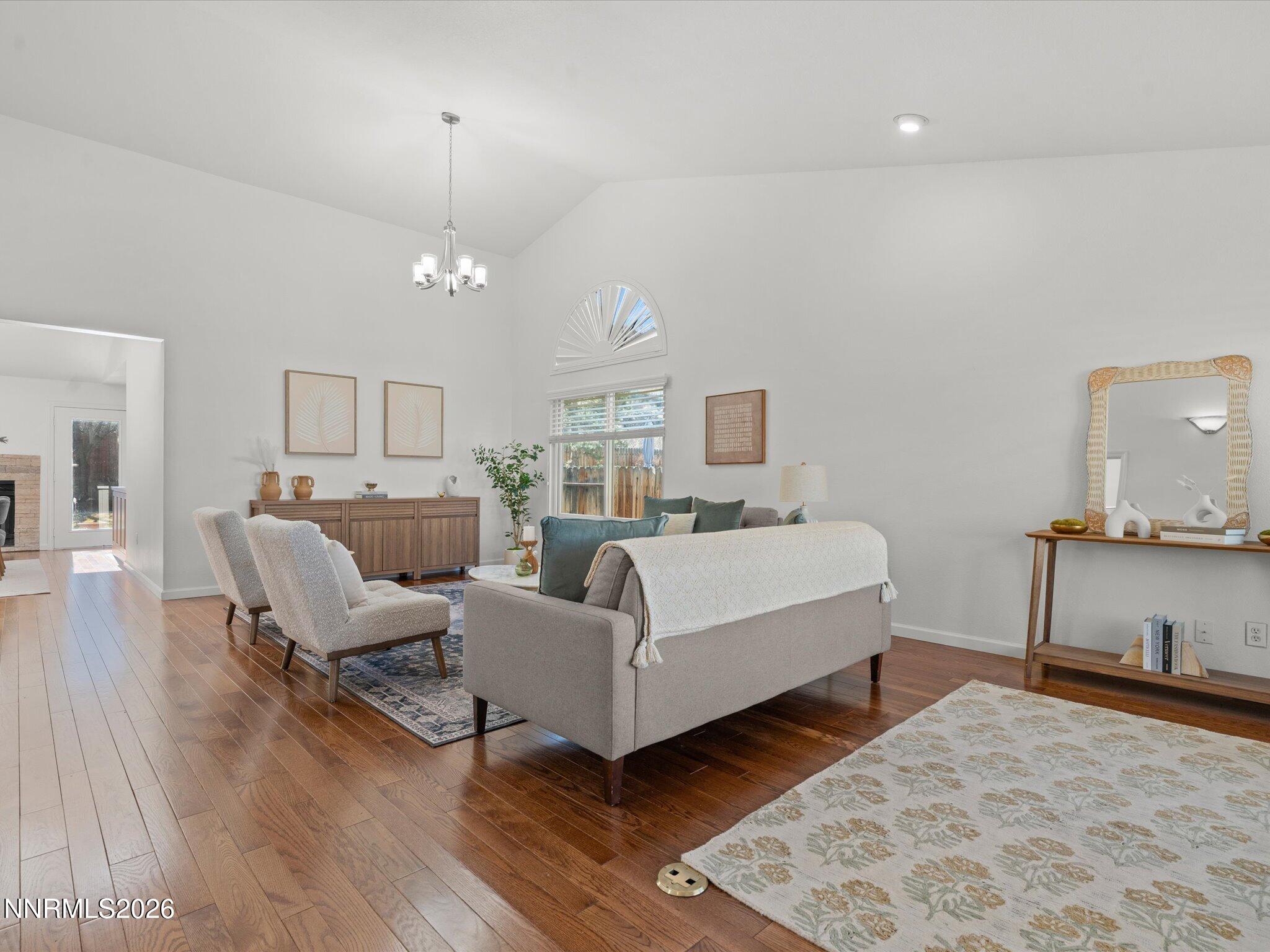 1588 Wheatgrass Drive Reno, NV 89509 - Photo 3 of 42 a living room with furniture and a wooden floor