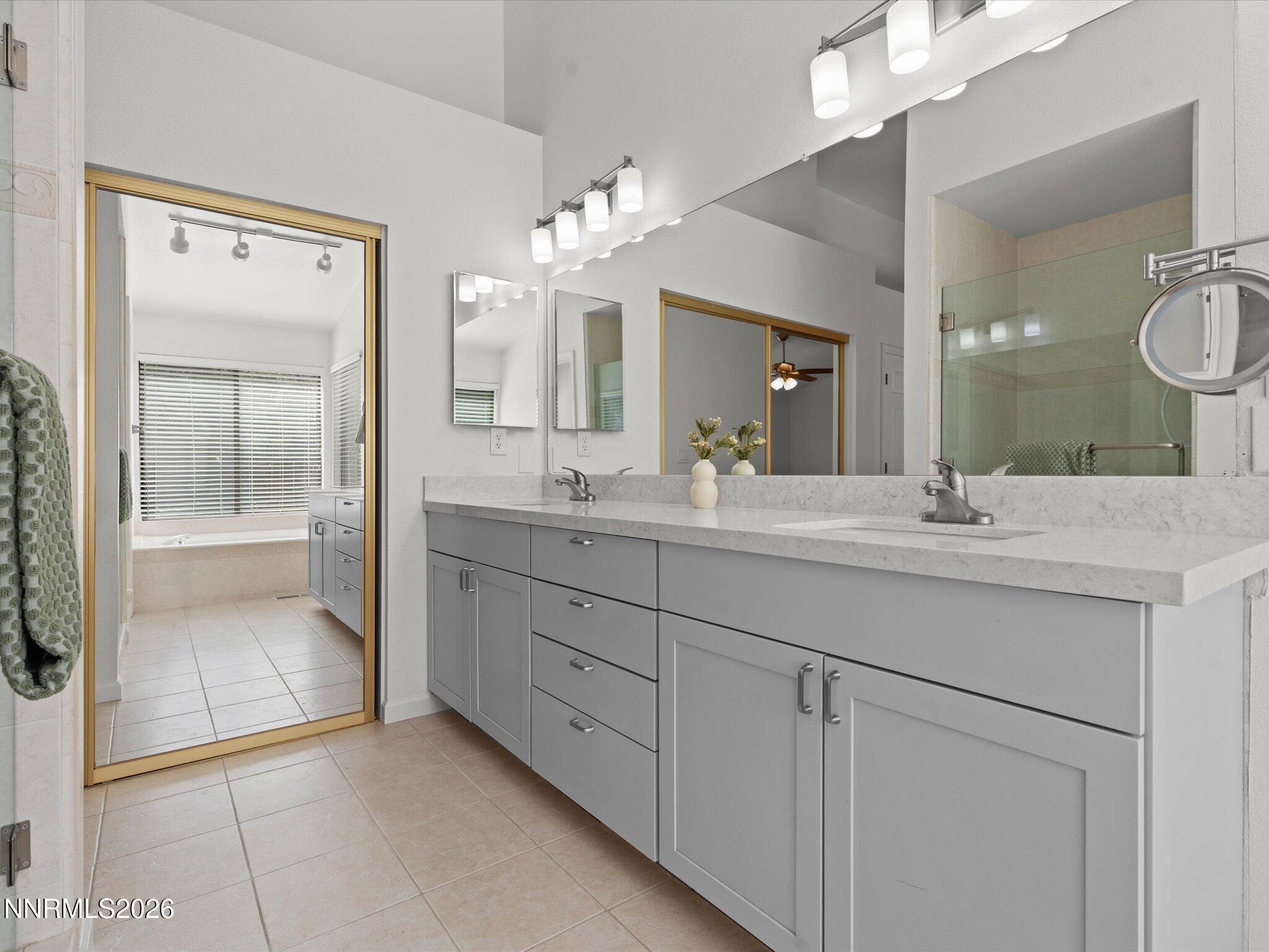 1588 Wheatgrass Drive Reno, NV 89509 - Photo 31 of 42 a bathroom with a double vanity sink and a mirror