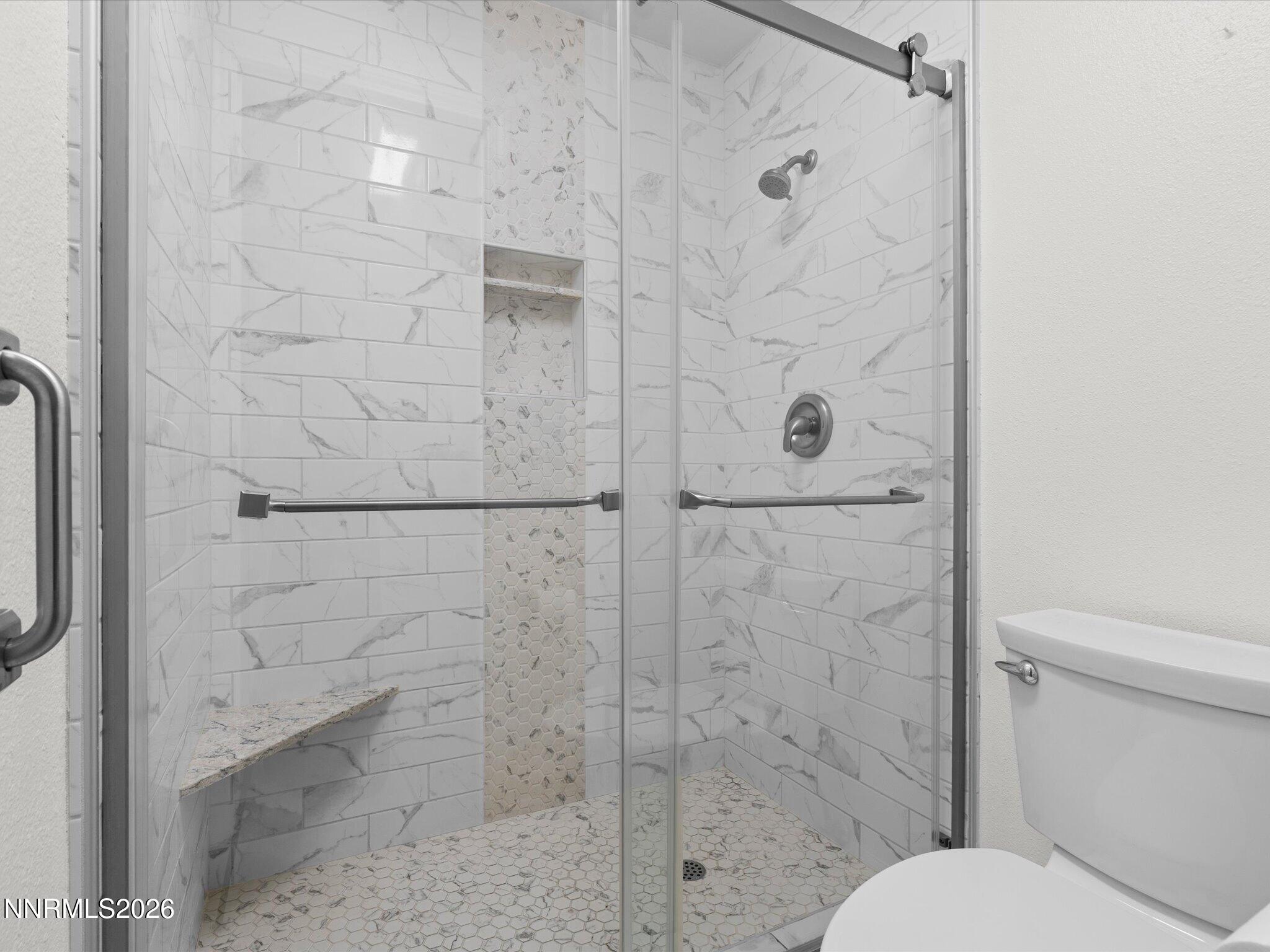 1588 Wheatgrass Drive Reno, NV 89509 - Photo 35 of 42 a bathroom with a toilet and a shower