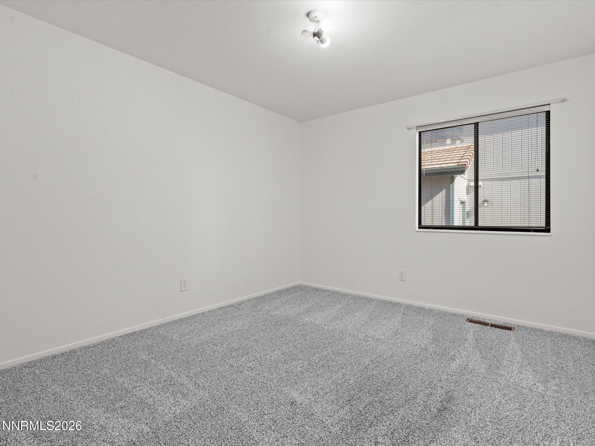 1588 Wheatgrass Drive Reno, NV 89509 - Photo 36 of 42 an empty room with a window