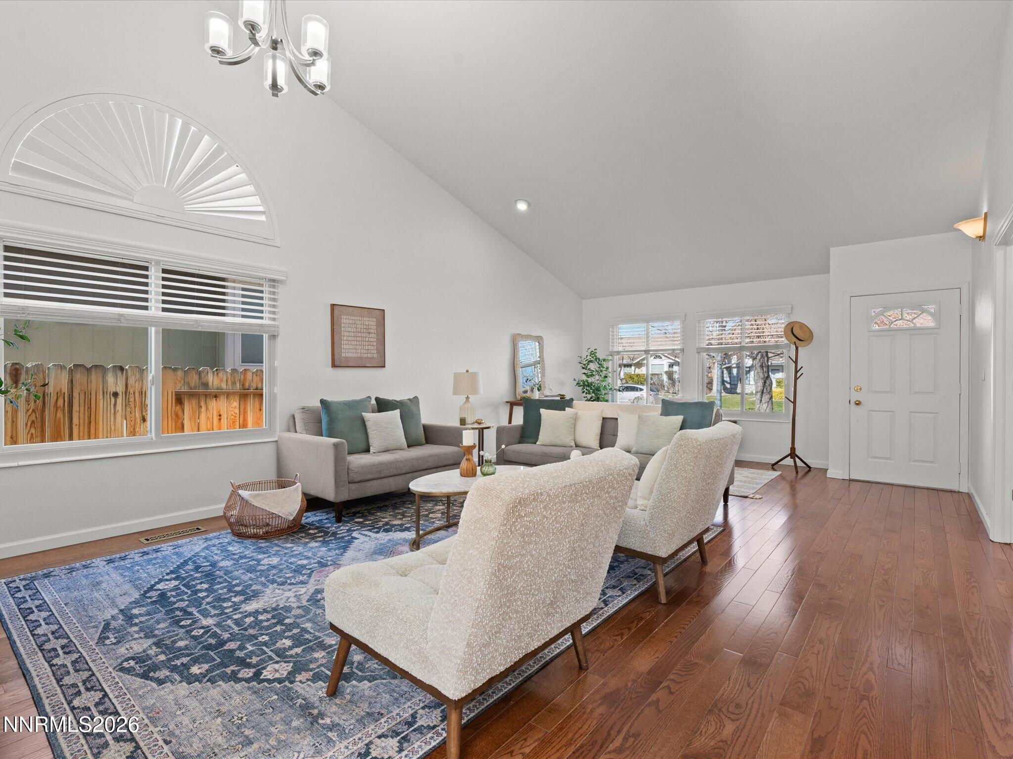 1588 Wheatgrass Drive Reno, NV 89509 - Photo 6 of 42 a living room with furniture and a chandelier