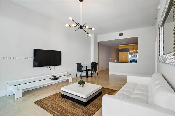 a living room with furniture and a table