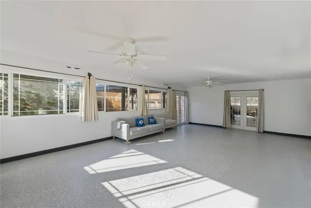 a view of livingroom with furniture and windows