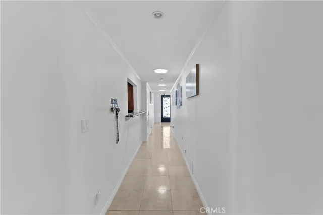 a view of a hallway with stairs