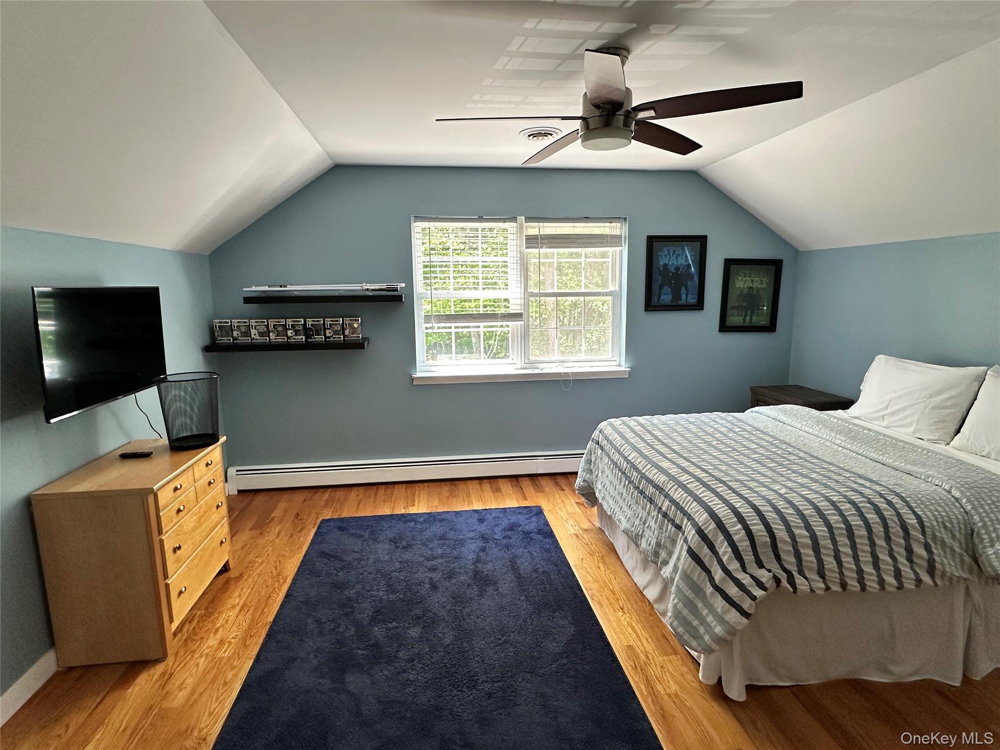 95 Weed Road Pine Bush, NY 12566 - Photo 18 of 31 Fourth bedroom with angled ceilings, light wood-finish flooring, and a ceiling fan