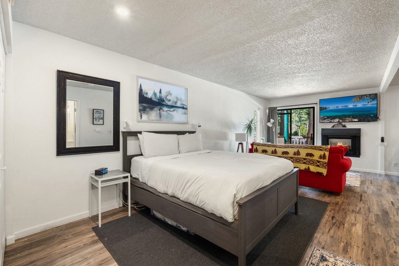 1300 Regency Way, Unit 62 Tahoe Vista, CA 96148 - Photo 17 of 26 a bedroom with bed and wooden floor