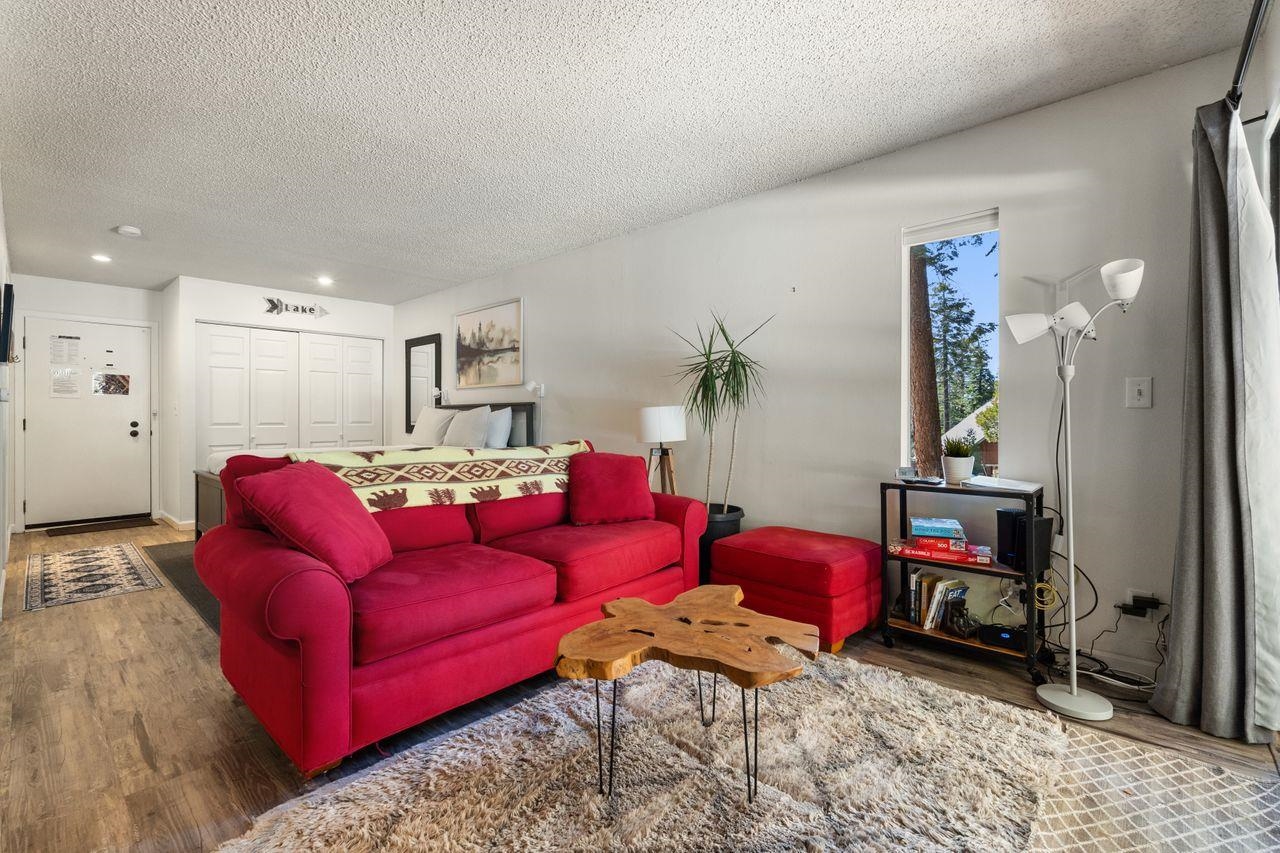 1300 Regency Way, Unit 62 Tahoe Vista, CA 96148 - Photo 2 of 26 a living room with furniture and a wooden floor
