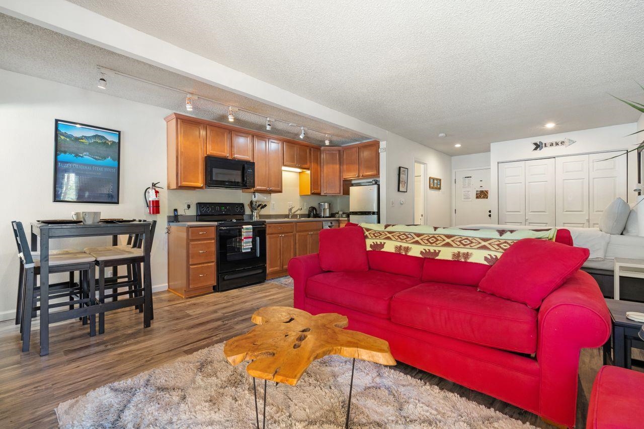 1300 Regency Way, Unit 62 Tahoe Vista, CA 96148 - Photo 3 of 26 a living room with furniture kitchen and a wooden floor