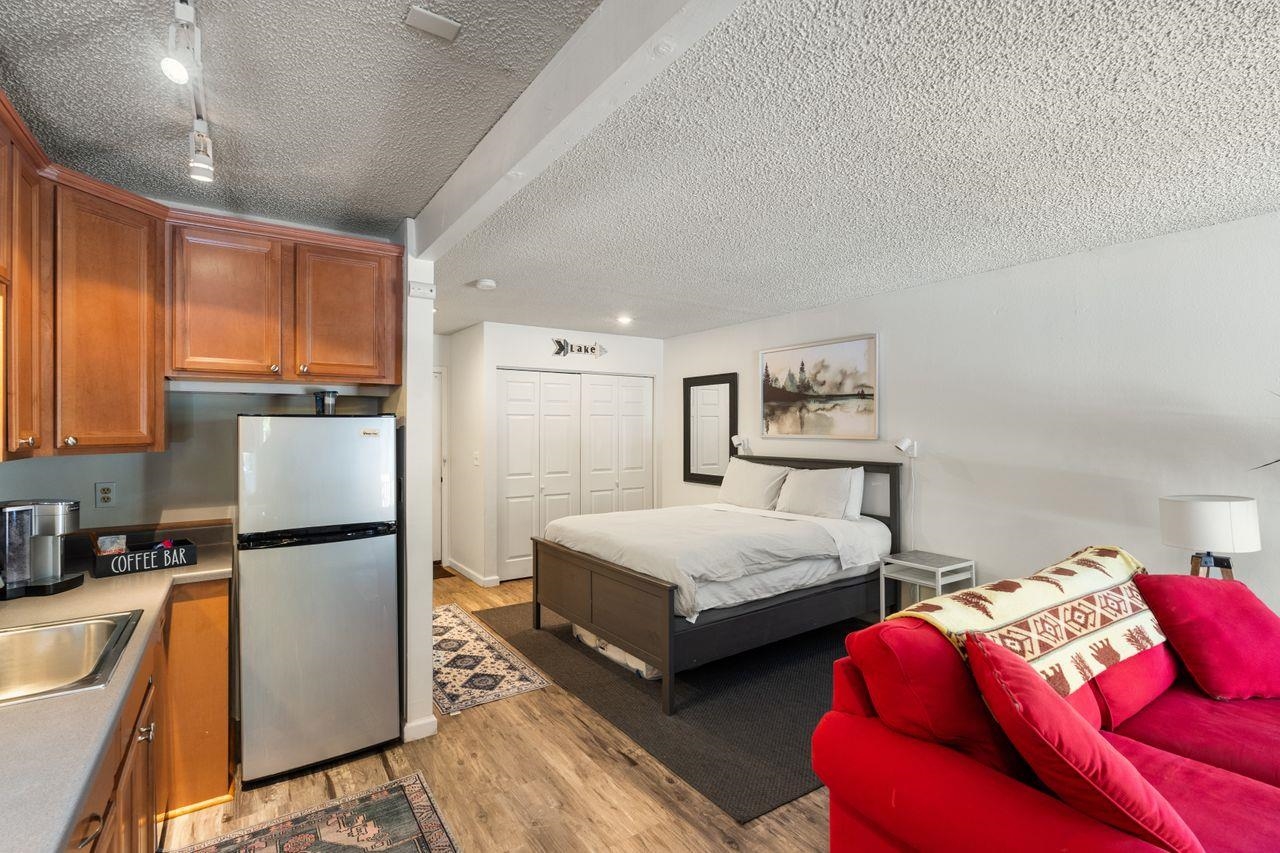 1300 Regency Way, Unit 62 Tahoe Vista, CA 96148 - Photo 10 of 26 a bedroom with bed and a couch