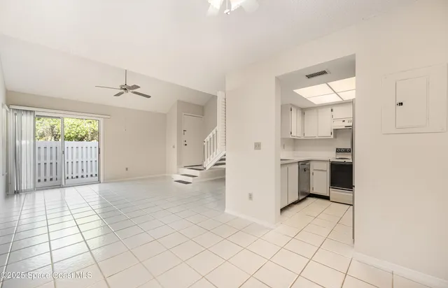 a view of a kitchen with windows