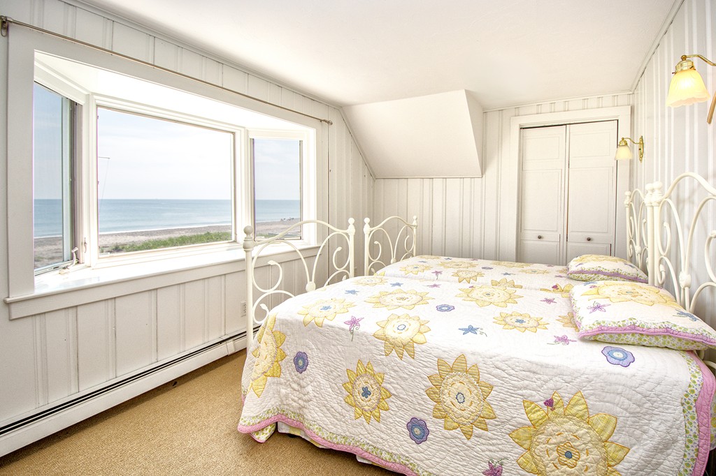 98 Humarock Beach Scituate, MA 02047 - Photo 13 of 14 a bedroom with a bed and a large window with outer view