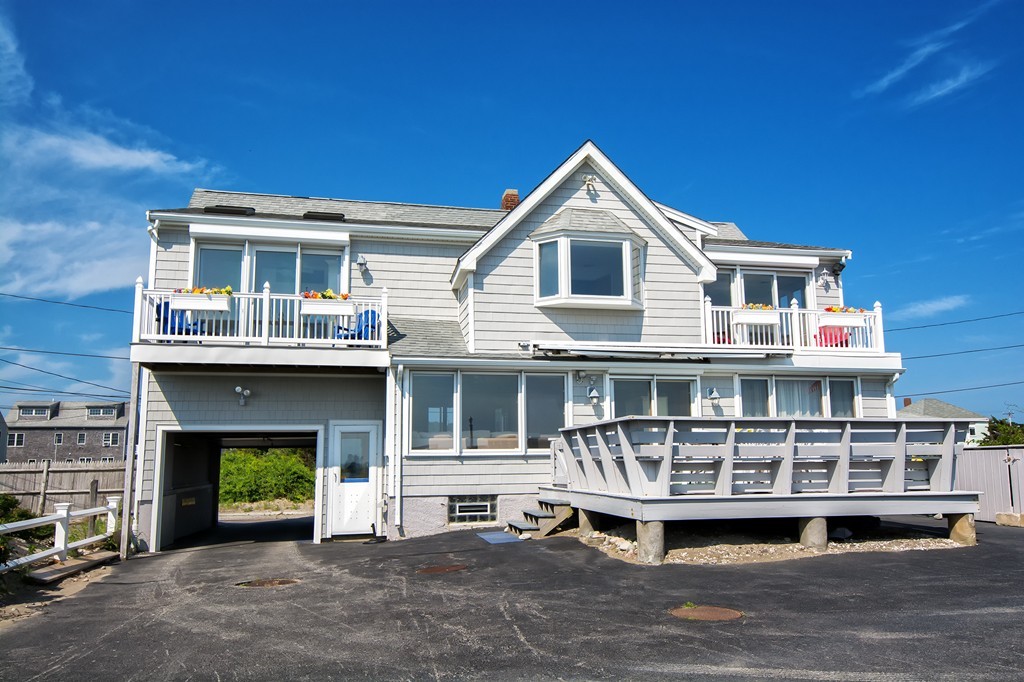 98 Humarock Beach Scituate, MA 02047 - Photo 2 of 14 a front view of a house with a yard