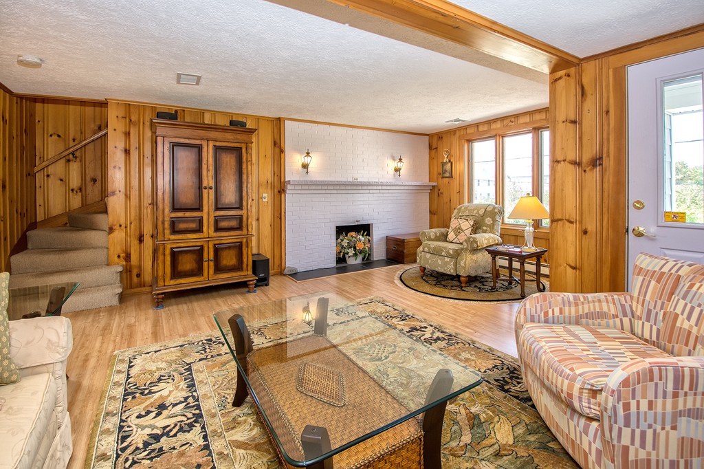 98 Humarock Beach Scituate, MA 02047 - Photo 6 of 14 a living room with furniture or couch and a fireplace