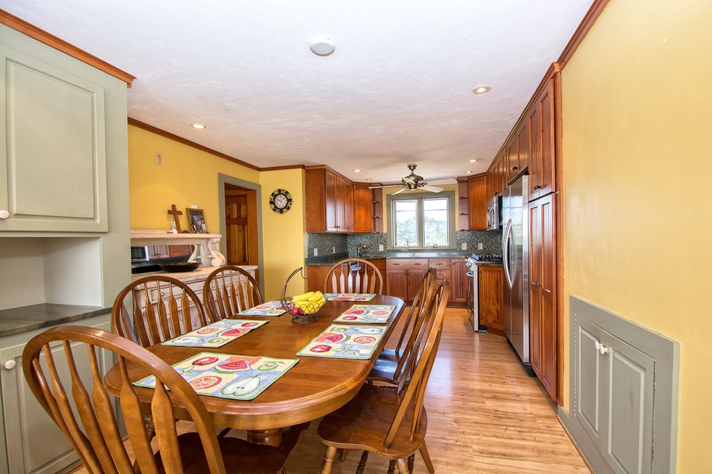 98 Humarock Beach Scituate, MA 02047 - Photo 8 of 14 a bedroom with furniture and a chandelier