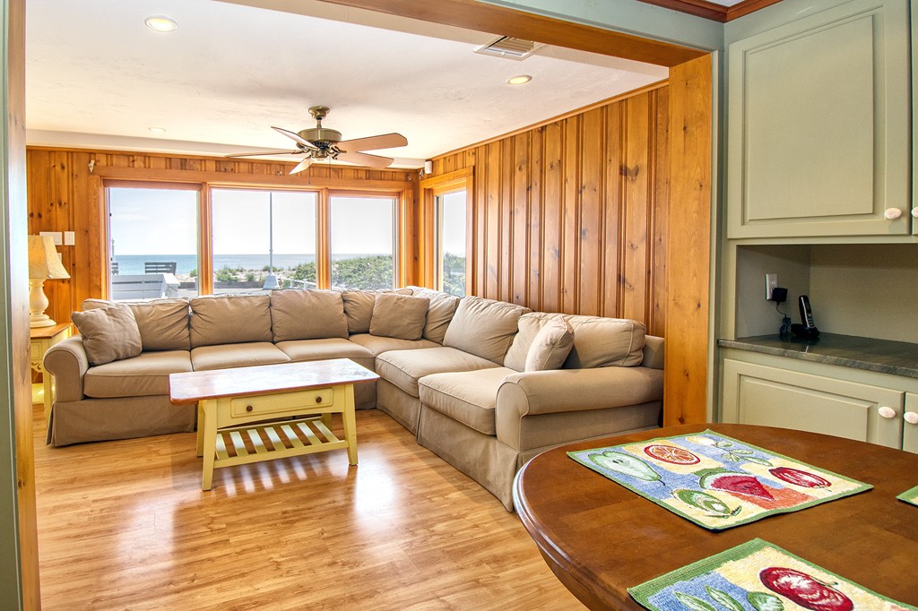 98 Humarock Beach Scituate, MA 02047 - Photo 9 of 14 a living room with furniture and a chandelier
