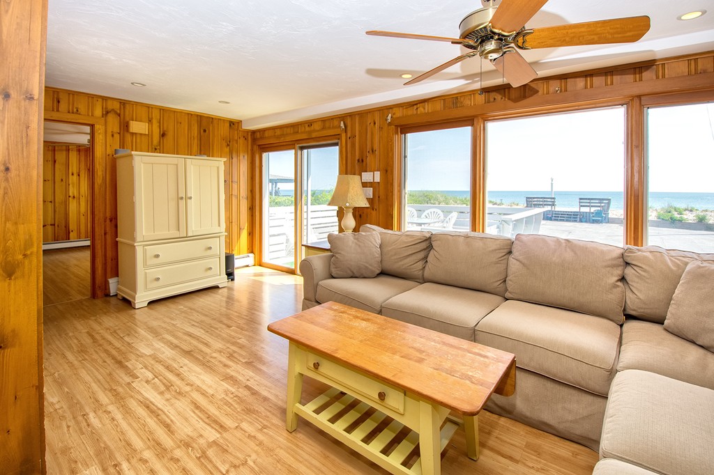 98 Humarock Beach Scituate, MA 02047 - Photo 10 of 14 a living room with furniture and a large window