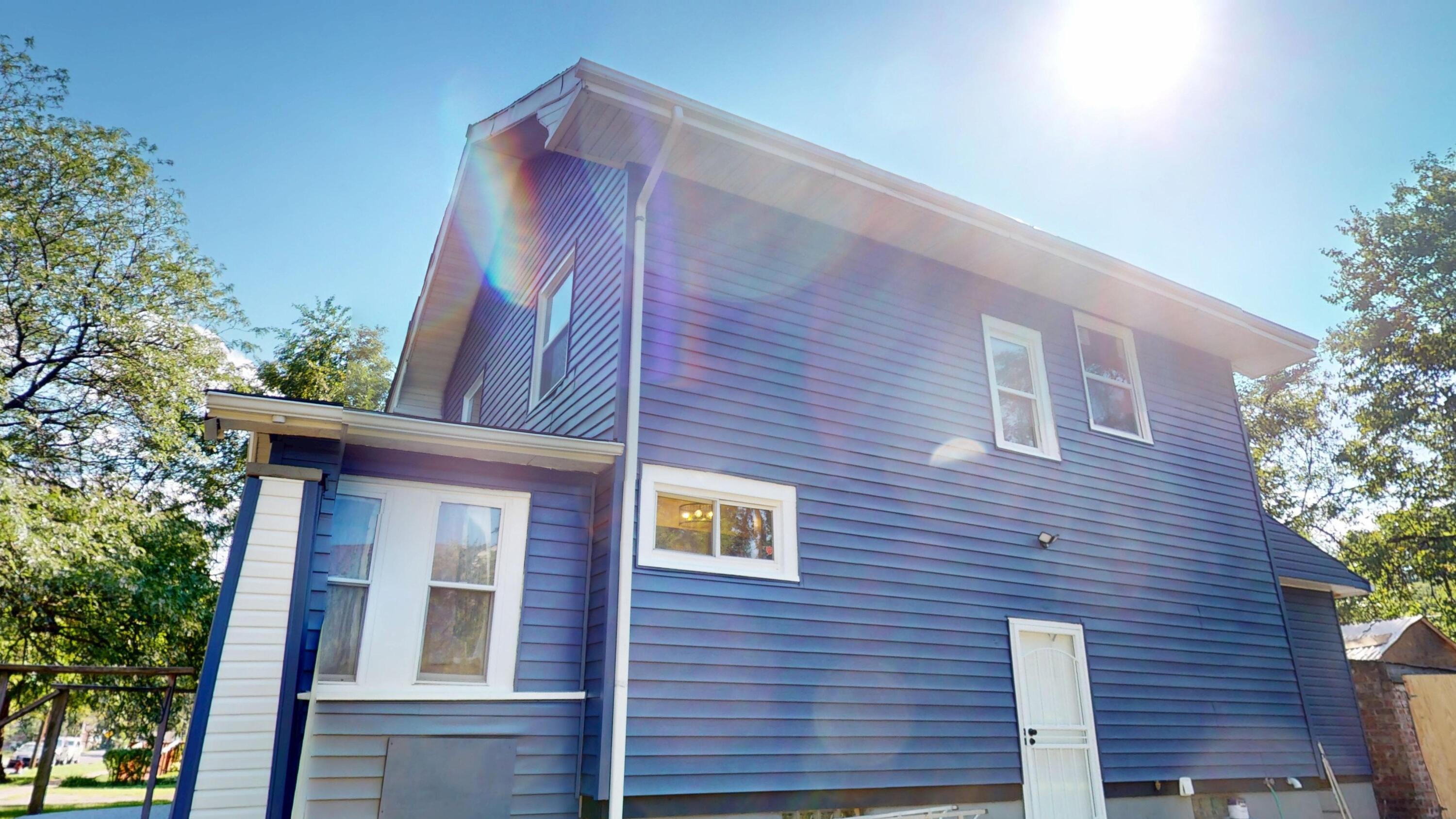 720 Maryland Street Gary, IN 46402 - Photo 33 of 38 a view of a brick building next to a yard