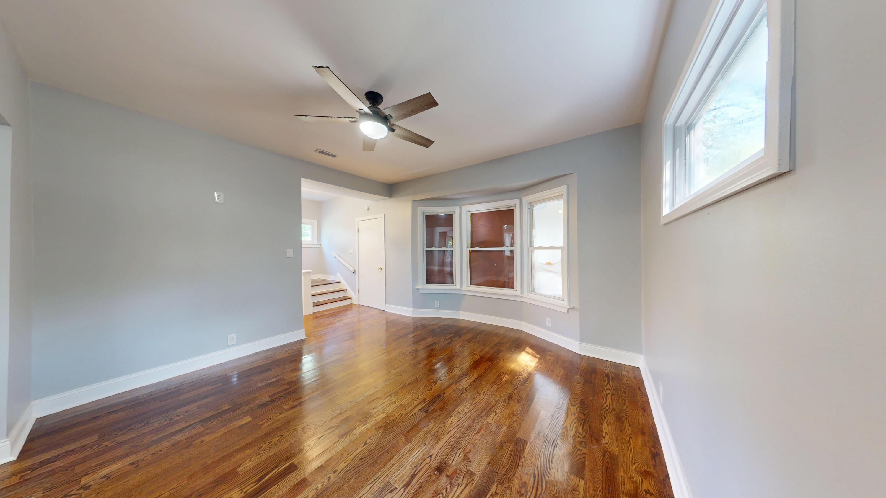 720 Maryland Street Gary, IN 46402 - Photo 8 of 38 a view of an empty room with a window and wooden floor