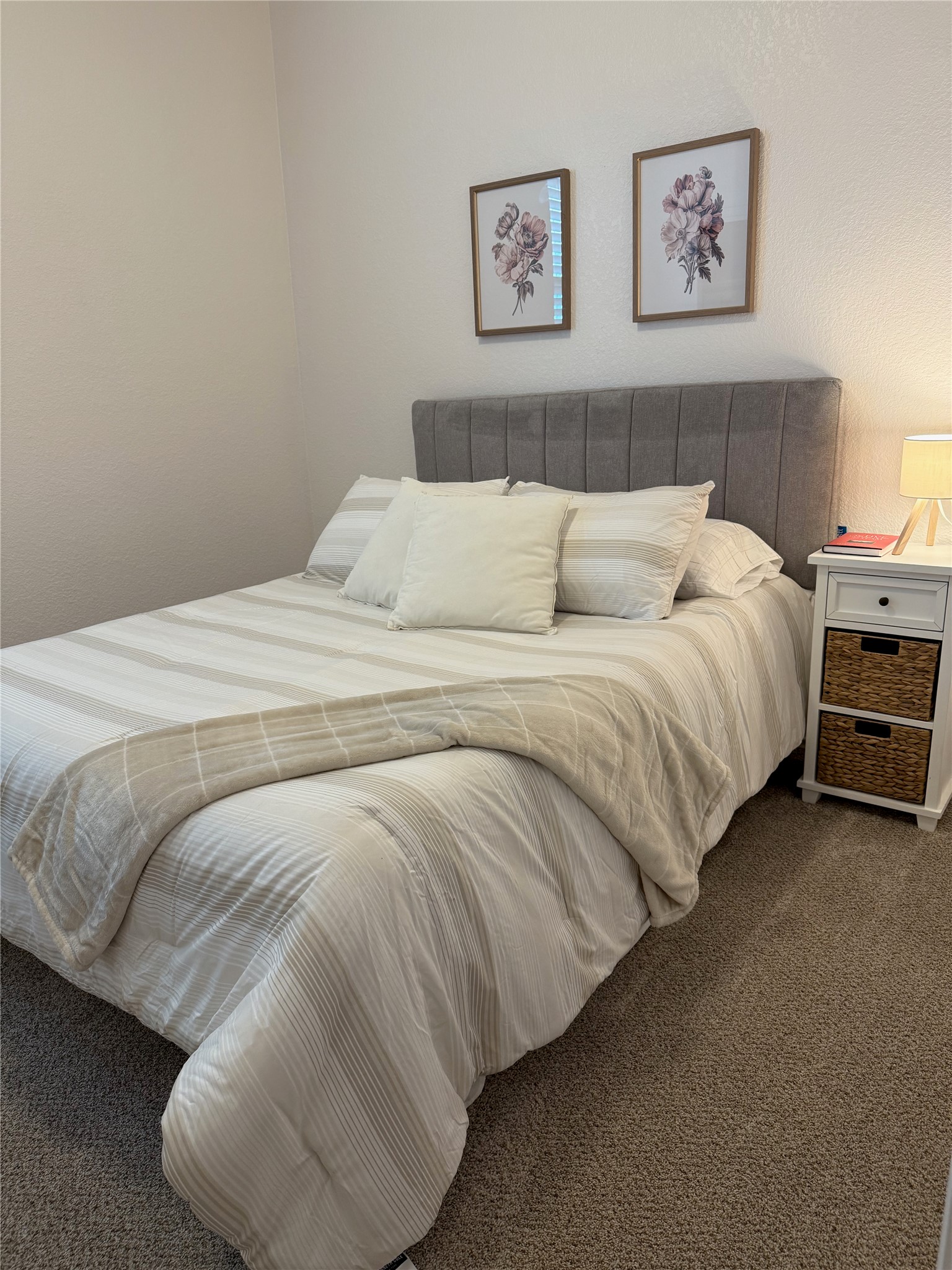 14907 Retha Pass Austin, TX 78725 - Photo 5 of 12 A plush headboard and soft bedding invite tranquil repose in this restful bedroom retreat.