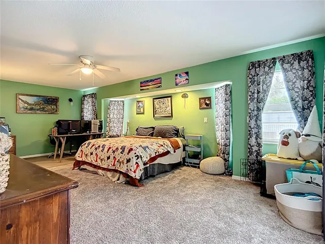 a bedroom with a bed and dresser