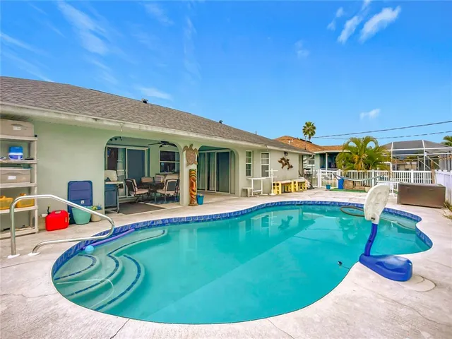 a view of a swimming pool with a patio