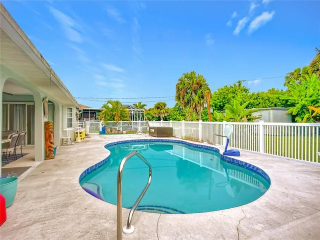 a view of a house with swimming pool
