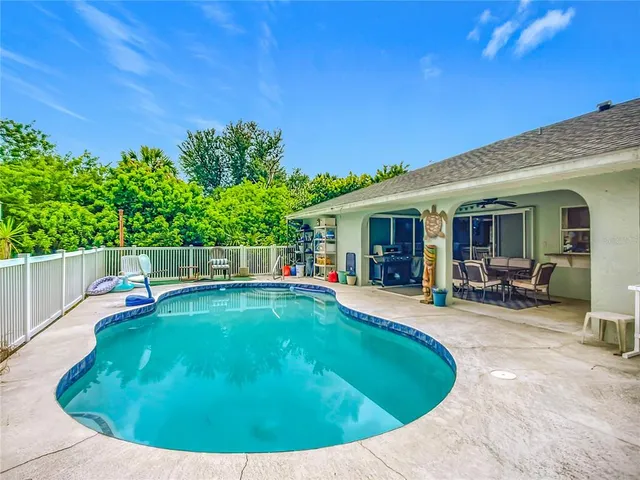 a view of a swimming pool with a patio