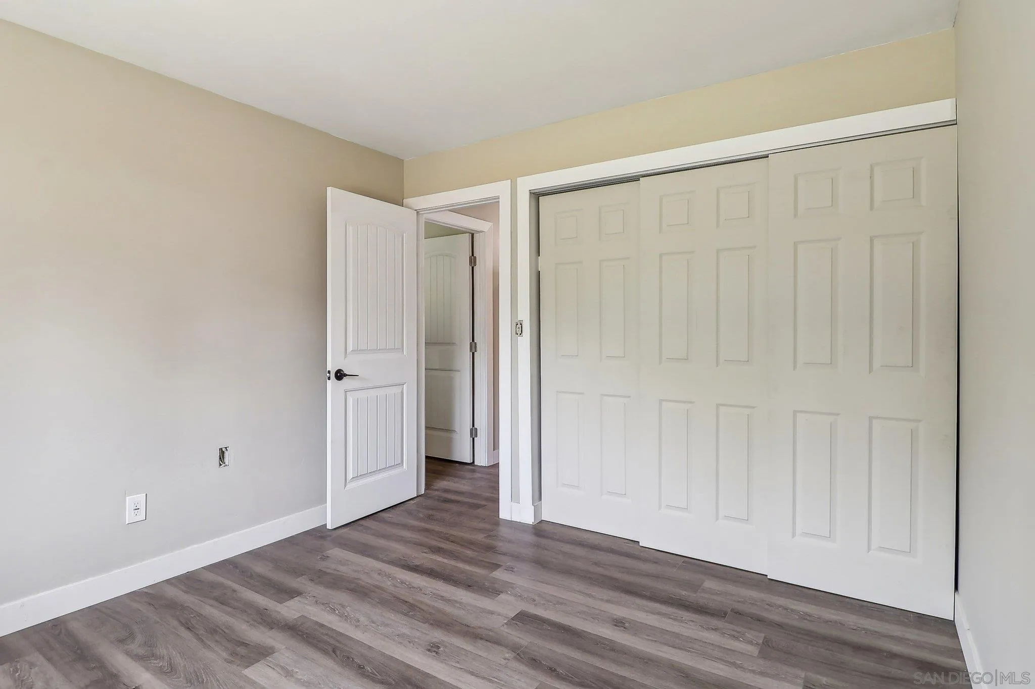 9055 Gorge Avenue Santee, CA 92071 - Photo 18 of 28 a view of an empty room with wooden floor