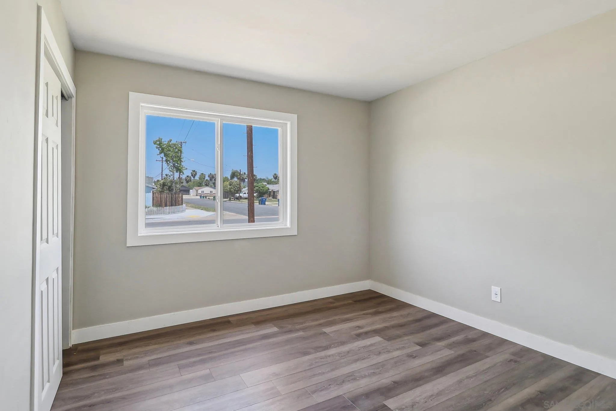 9055 Gorge Avenue Santee, CA 92071 - Photo 20 of 28 a view of empty room with wooden floor and fan