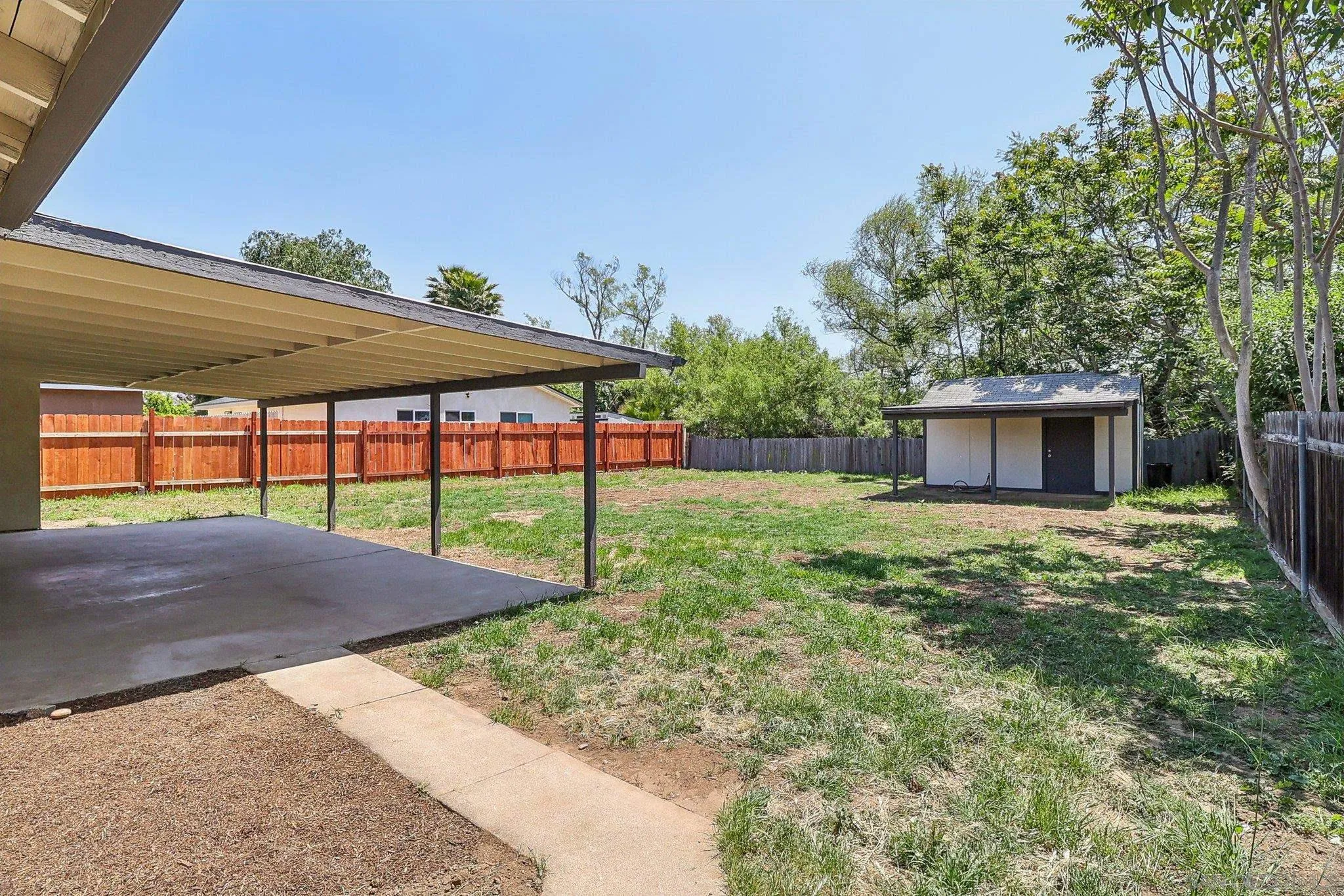 9055 Gorge Avenue Santee, CA 92071 - Photo 22 of 28 a backyard of a house with table and chairs