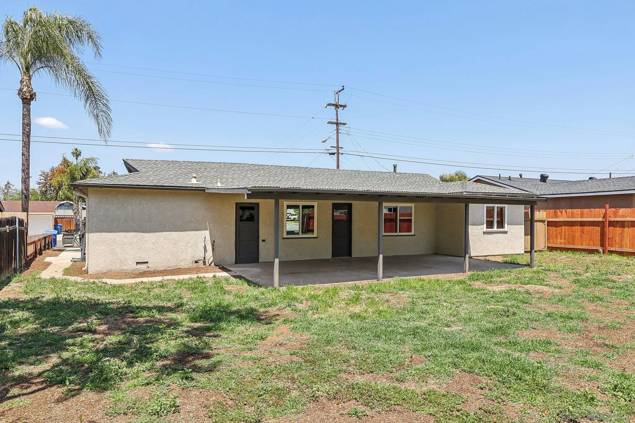 9055 Gorge Avenue Santee, CA 92071 - Photo 23 of 28 a front view of a house with a yard