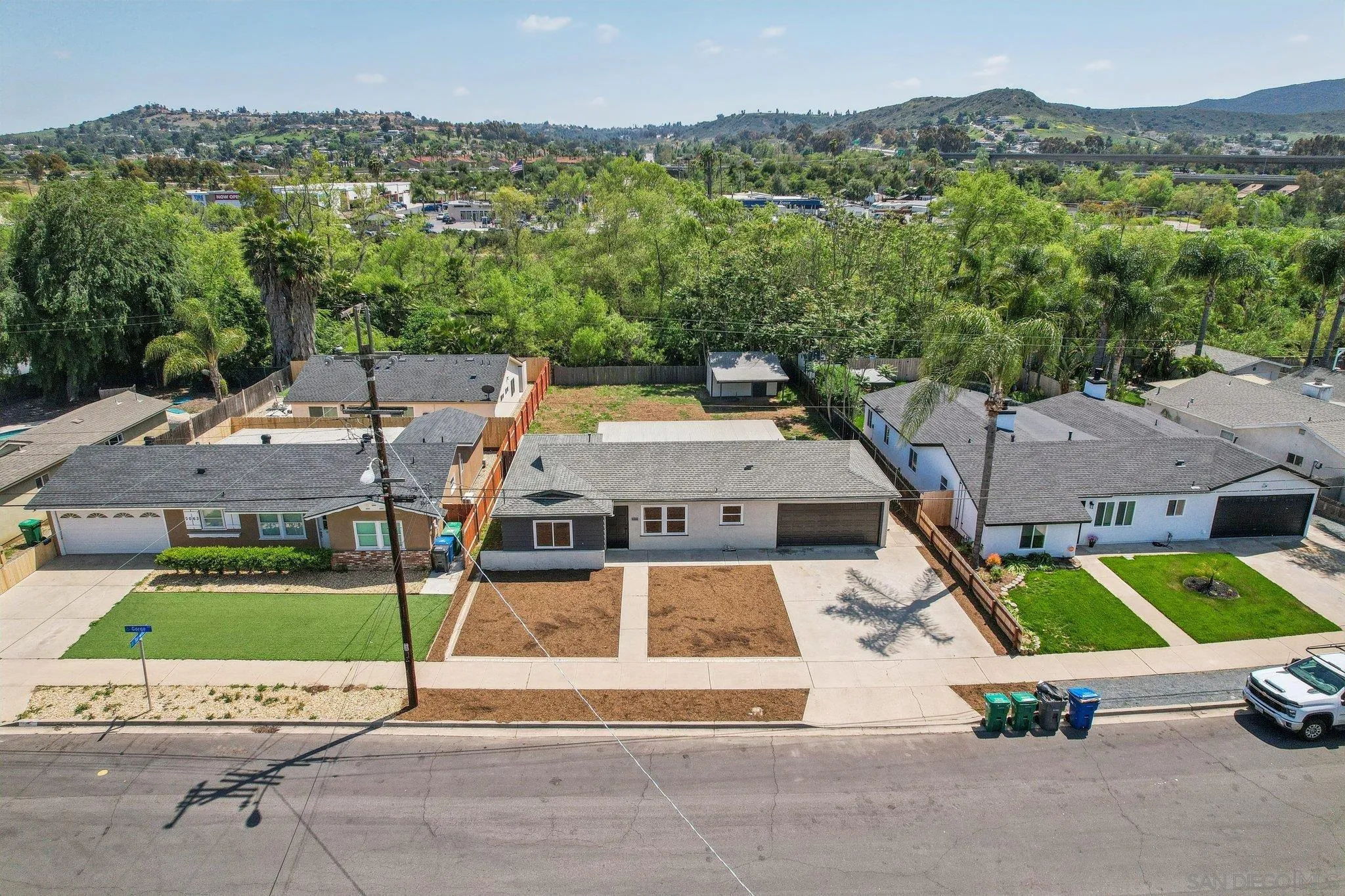 9055 Gorge Avenue Santee, CA 92071 - Photo 25 of 28 an aerial view of a house with a garden and lake view