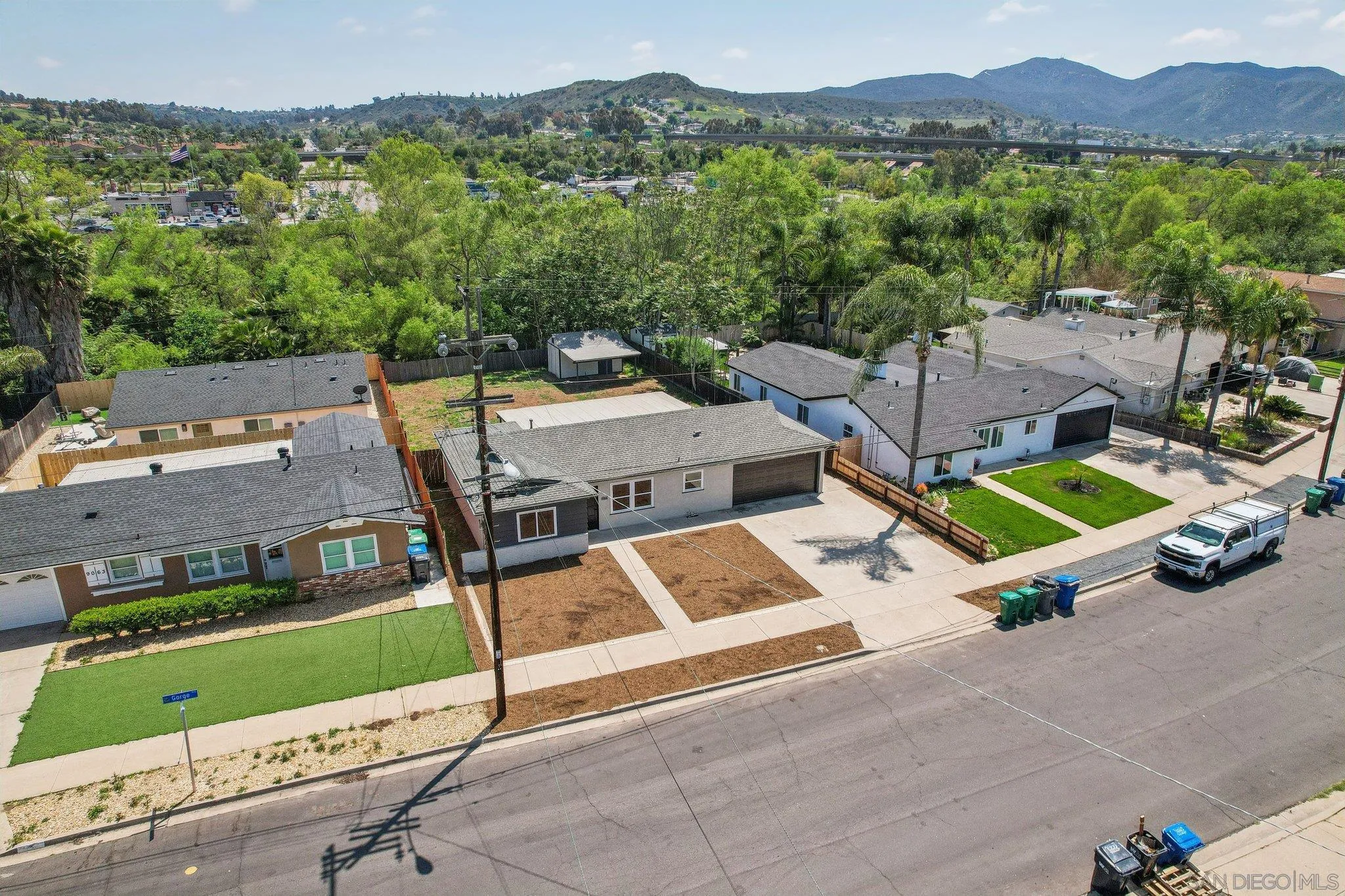 9055 Gorge Avenue Santee, CA 92071 - Photo 26 of 28 an aerial view of a house with swimming pool and a yard