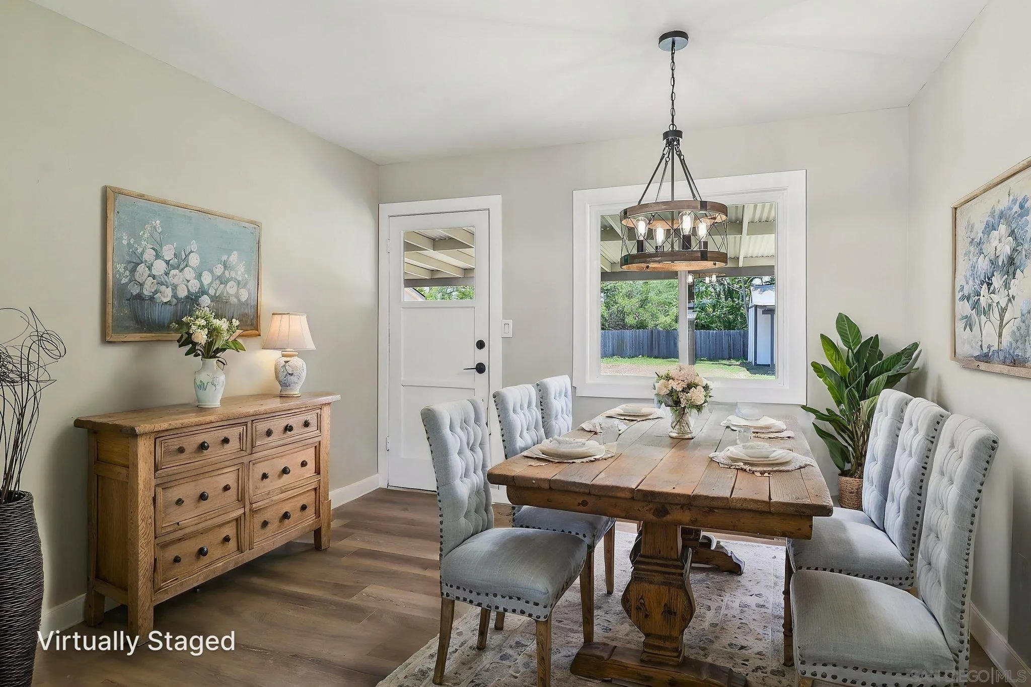 9055 Gorge Avenue Santee, CA 92071 - Photo 4 of 28 a view of a dining room with furniture window and wooden floor
