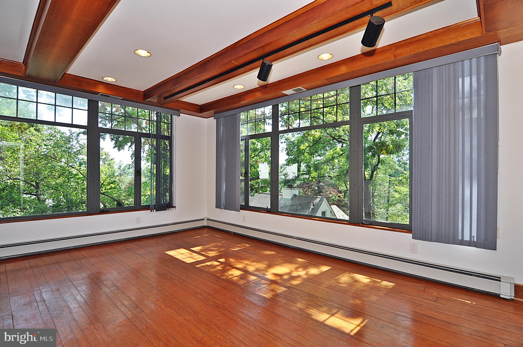 2721 South Arlington Ridge Road Arlington, VA 22202 - Photo 12 of 33 a view of an empty room with a window and wooden floor