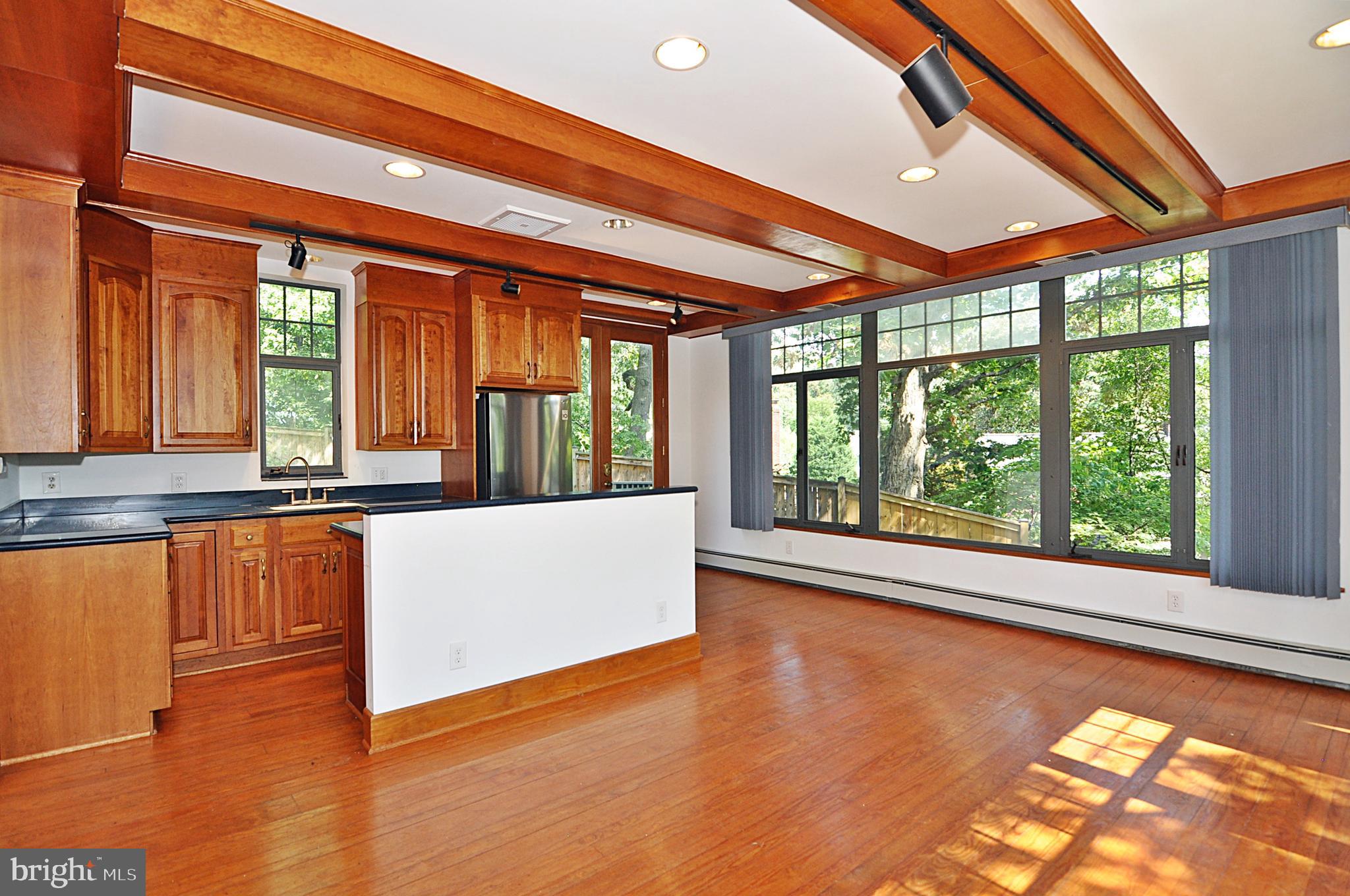 2721 South Arlington Ridge Road Arlington, VA 22202 - Photo 14 of 33 a large white kitchen with a large window