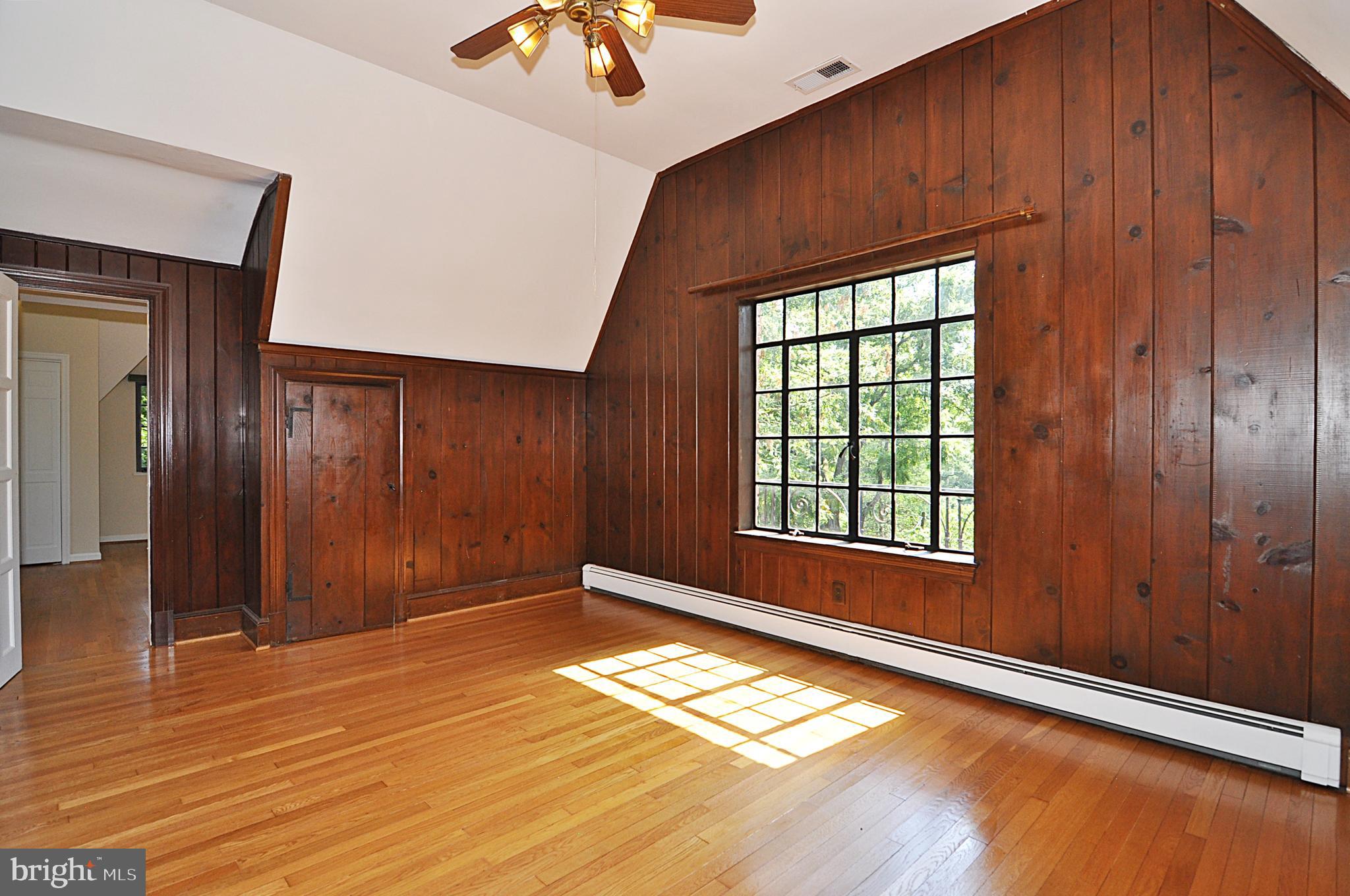 2721 South Arlington Ridge Road Arlington, VA 22202 - Photo 20 of 33 a view of empty room with window and wooden floor