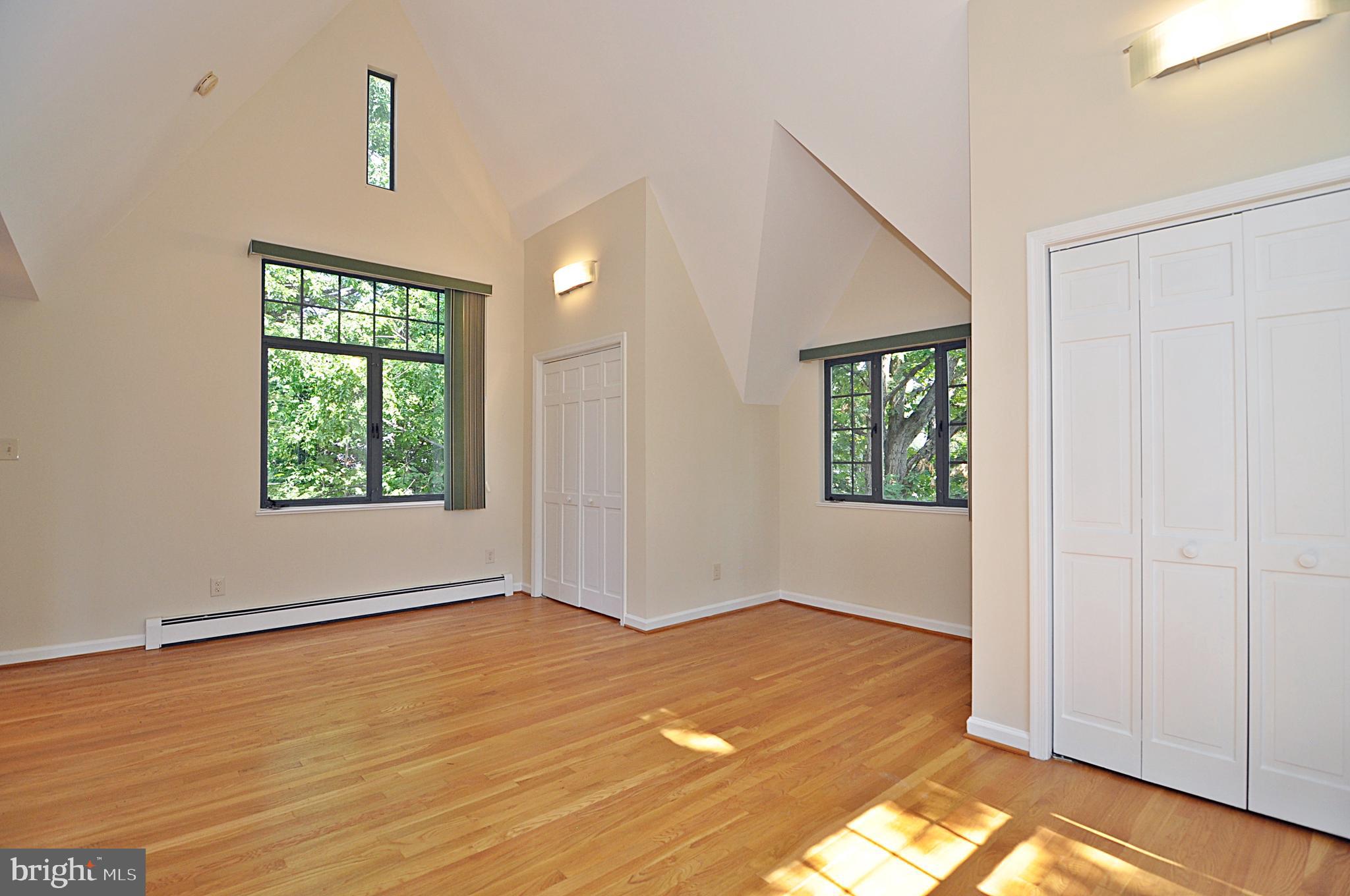 2721 South Arlington Ridge Road Arlington, VA 22202 - Photo 22 of 33 an empty room with windows and closet