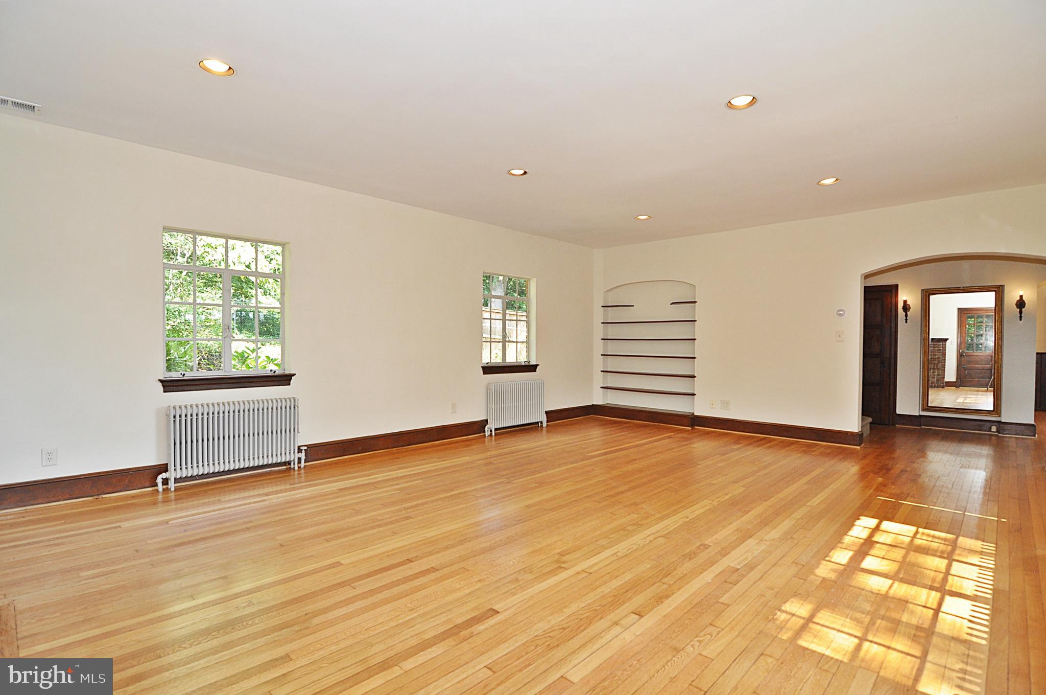 2721 South Arlington Ridge Road Arlington, VA 22202 - Photo 5 of 33 wooden floor in an empty room with a window