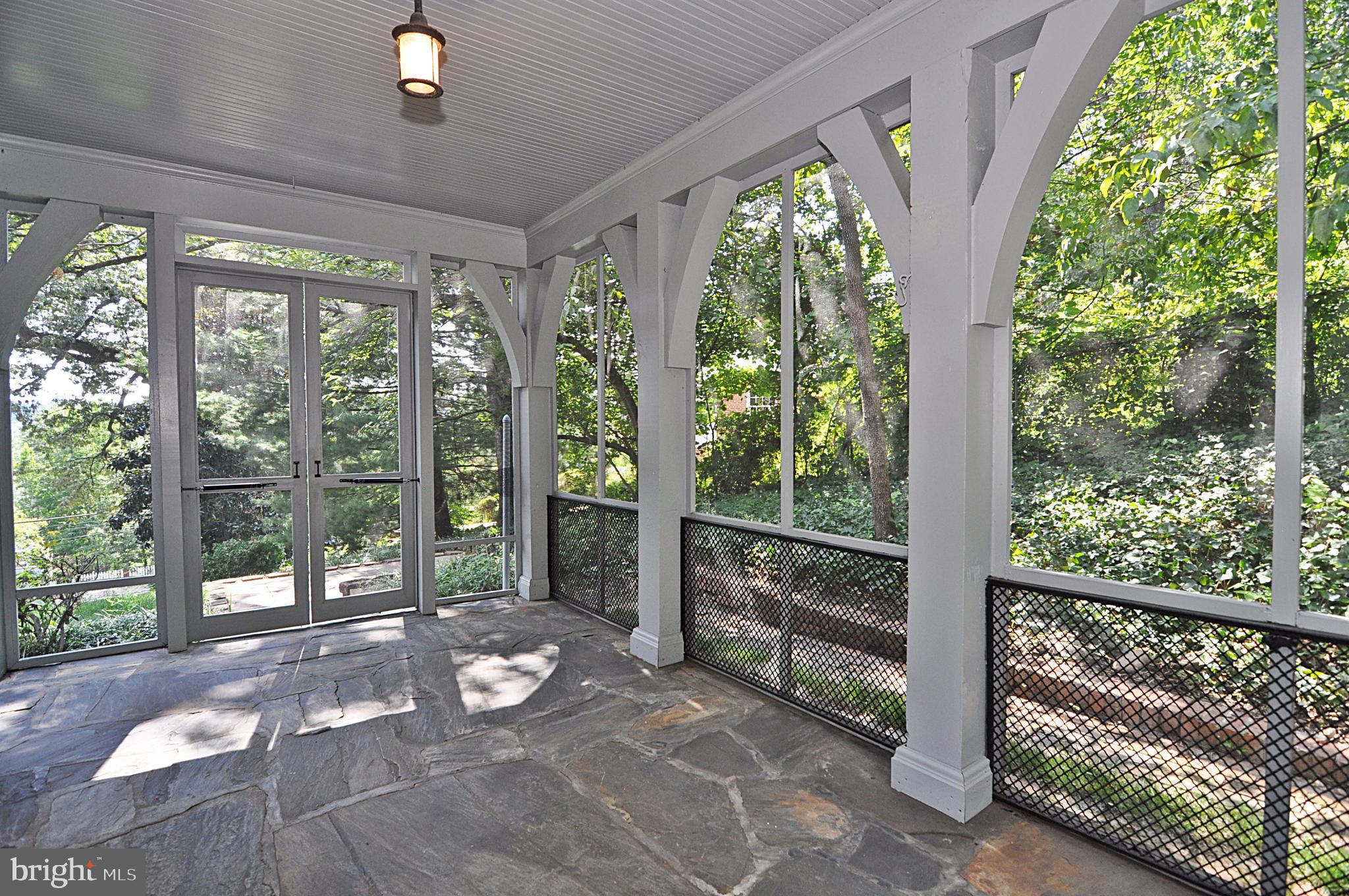 2721 South Arlington Ridge Road Arlington, VA 22202 - Photo 6 of 33 a room with large trees and plants