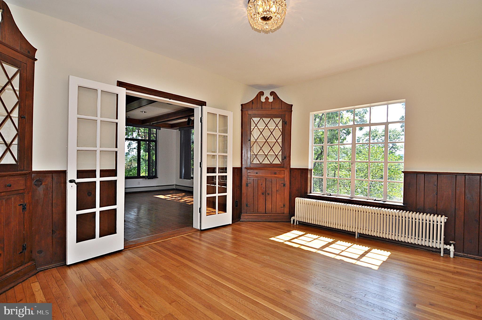 2721 South Arlington Ridge Road Arlington, VA 22202 - Photo 7 of 33 a view of empty room with wooden floor and fan