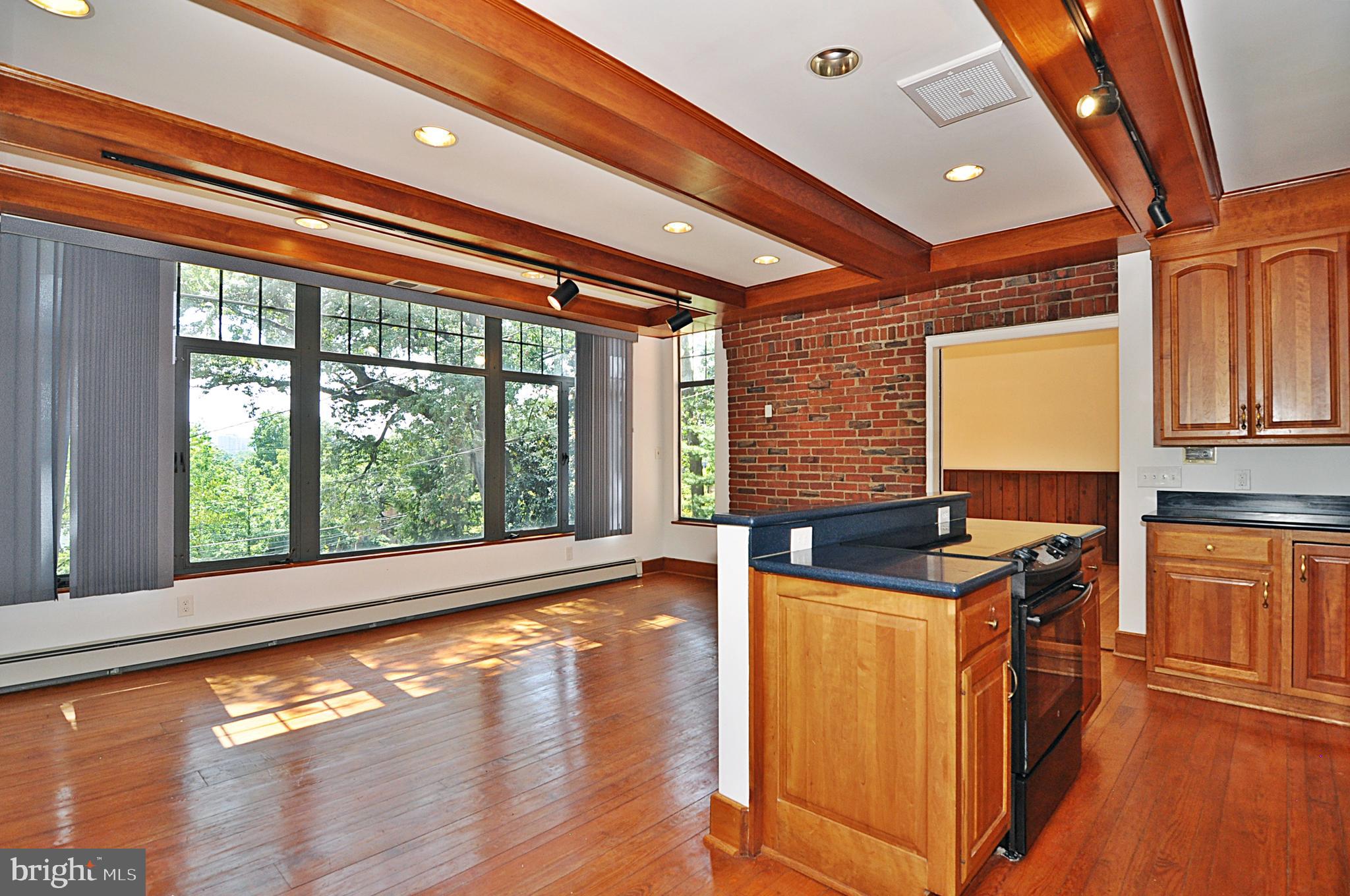 2721 South Arlington Ridge Road Arlington, VA 22202 - Photo 8 of 33 a kitchen with granite countertop a stove and a wooden floor