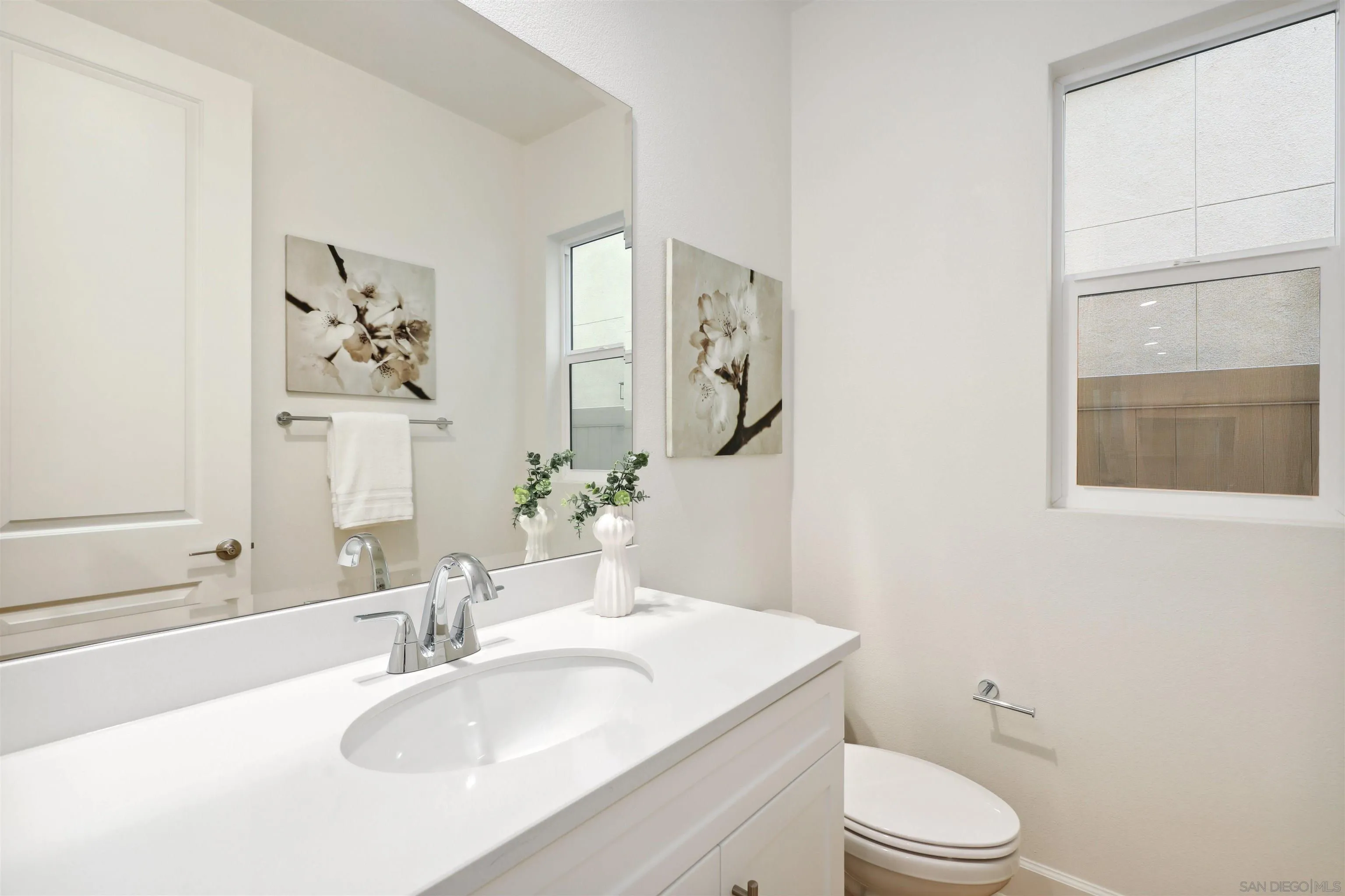 929 Woodhaven Road San Marcos, CA 92069 - Photo 14 of 36 a bathroom with a granite countertop sink toilet a mirror and shower