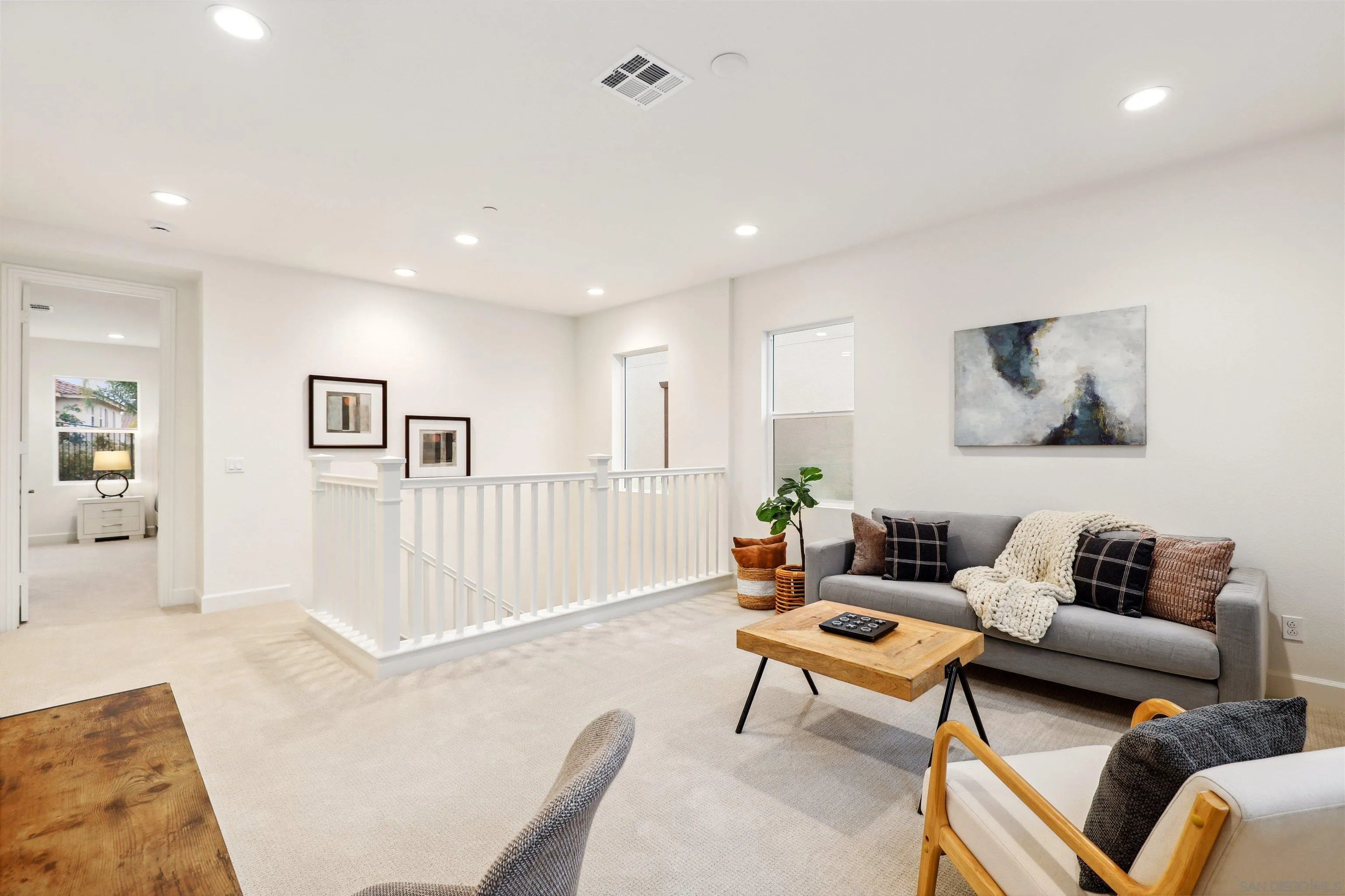 929 Woodhaven Road San Marcos, CA 92069 - Photo 17 of 36 a living room with furniture and a rug