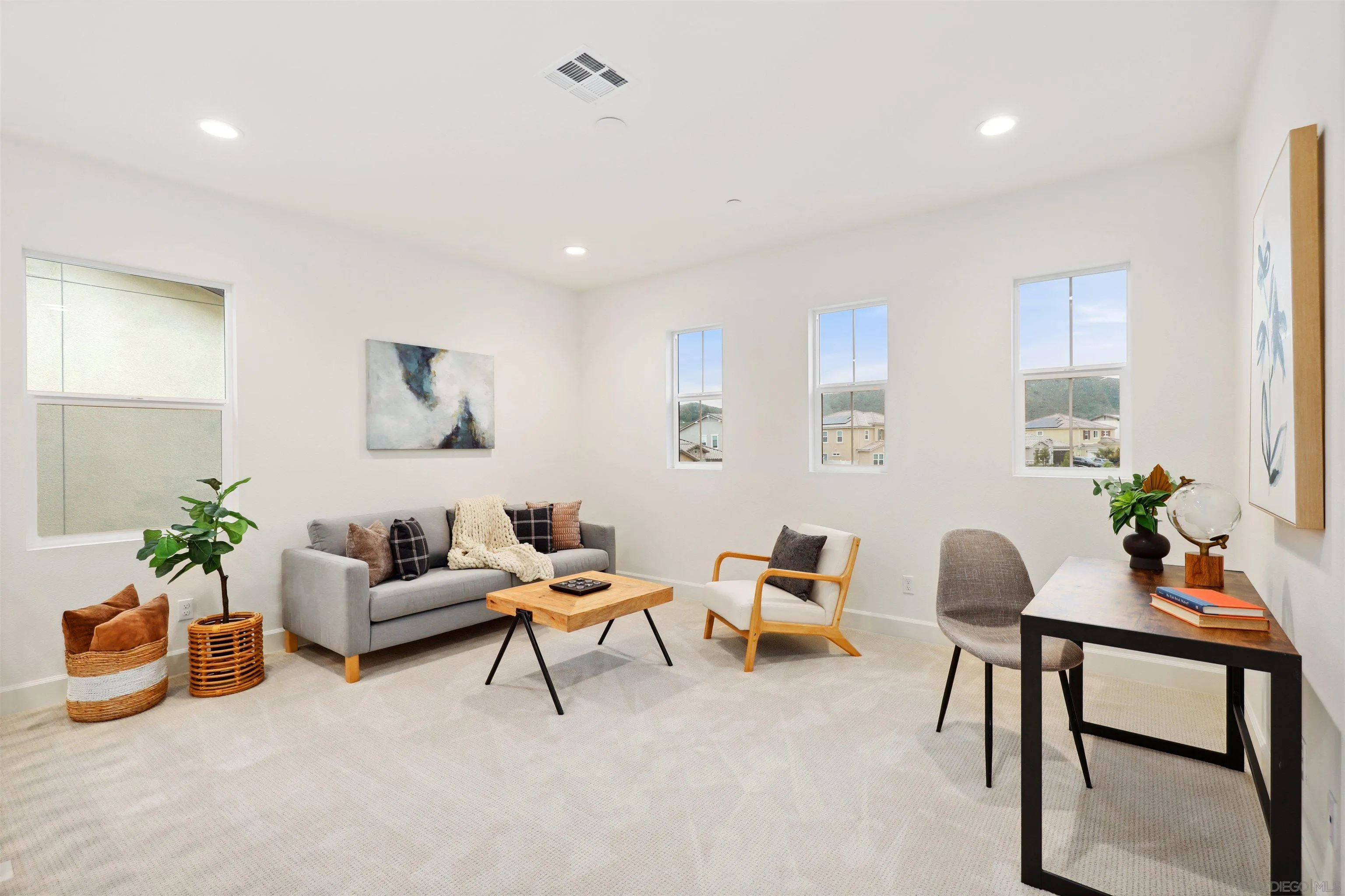 929 Woodhaven Road San Marcos, CA 92069 - Photo 18 of 36 a living room with furniture and a potted plant