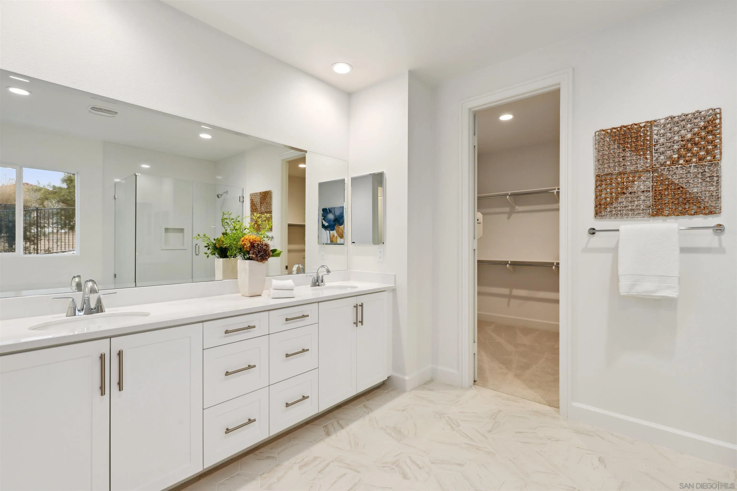 929 Woodhaven Road San Marcos, CA 92069 - Photo 20 of 36 a bathroom with a double vanity sink and mirror