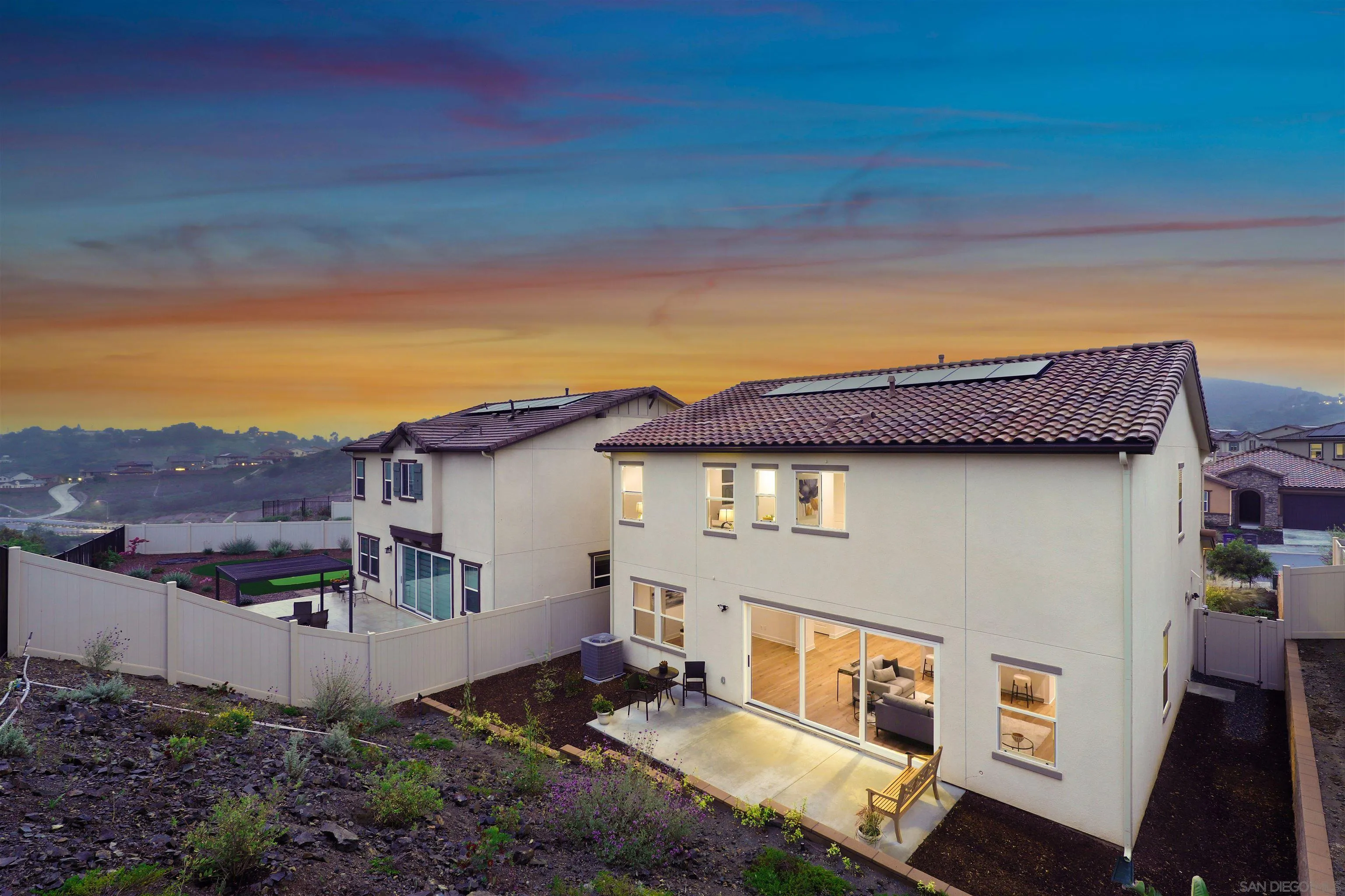 929 Woodhaven Road San Marcos, CA 92069 - Photo 2 of 36 a view of a white house next to a yard