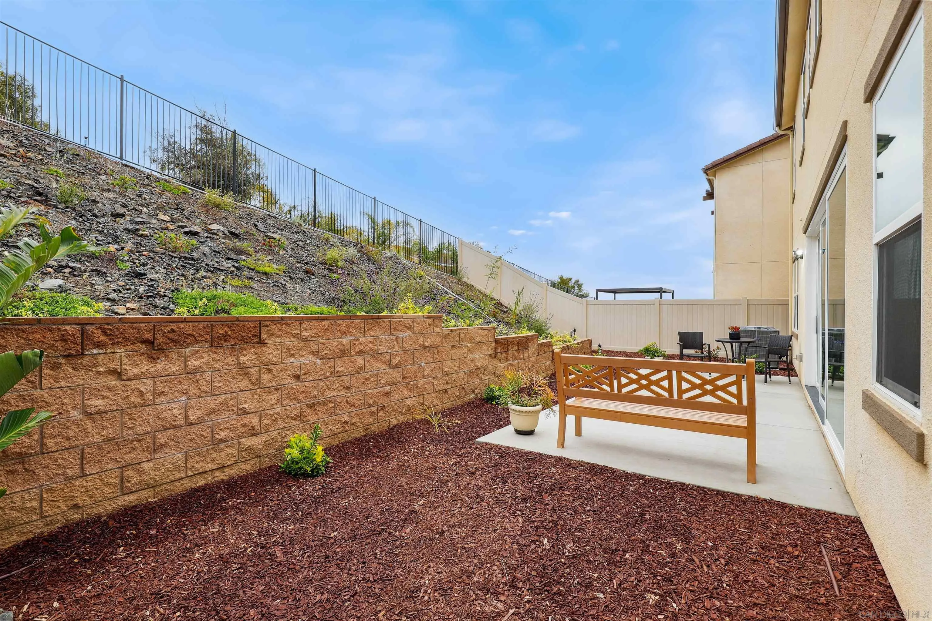 929 Woodhaven Road San Marcos, CA 92069 - Photo 32 of 36 a view of a pathway with a bench in front of house