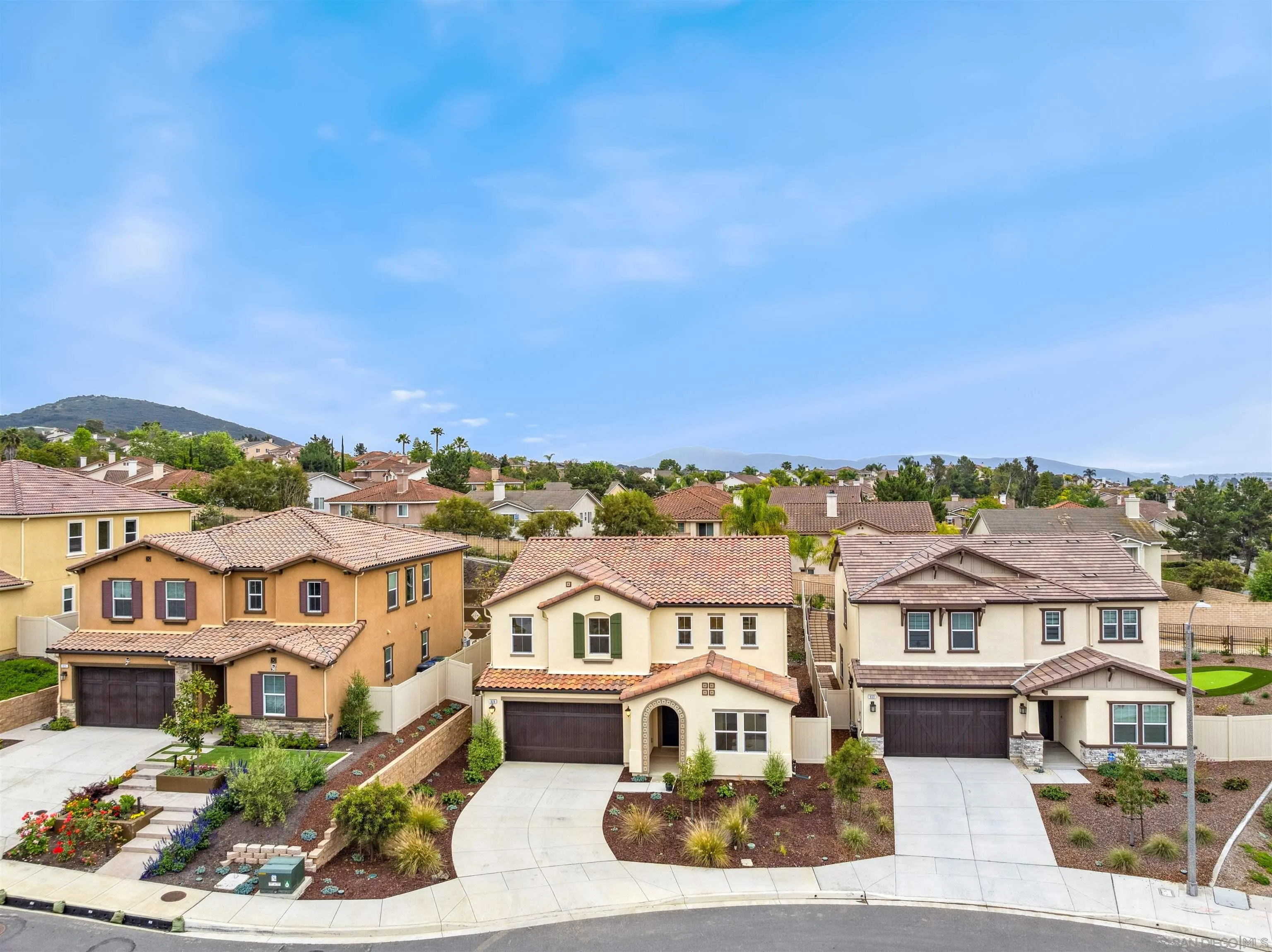 929 Woodhaven Road San Marcos, CA 92069 - Photo 4 of 36 an aerial view of a residential apartment building with a yard