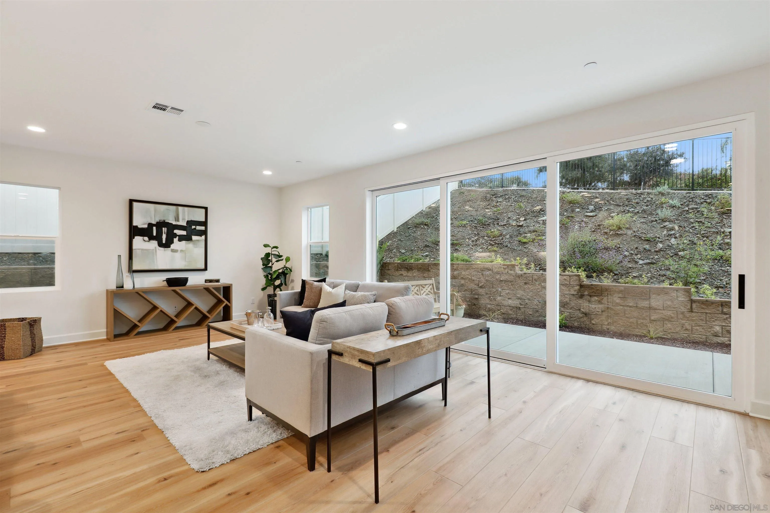 929 Woodhaven Road San Marcos, CA 92069 - Photo 7 of 36 a living room with furniture and a large window